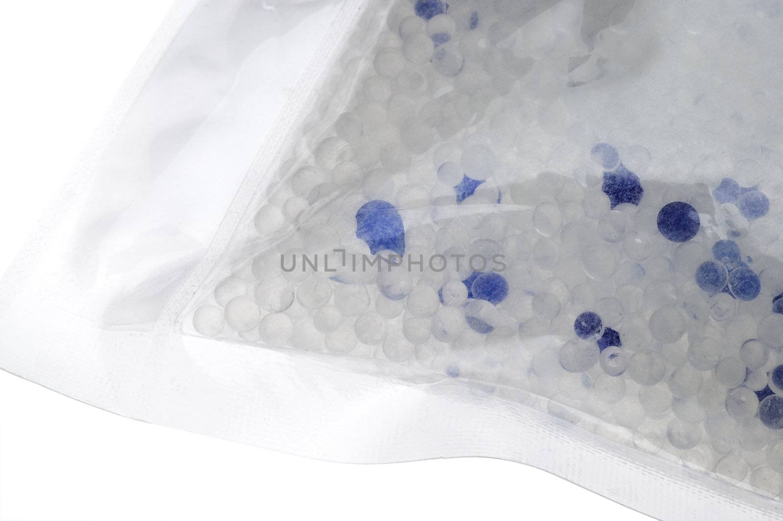 silica gel bead dessiccant package over white background