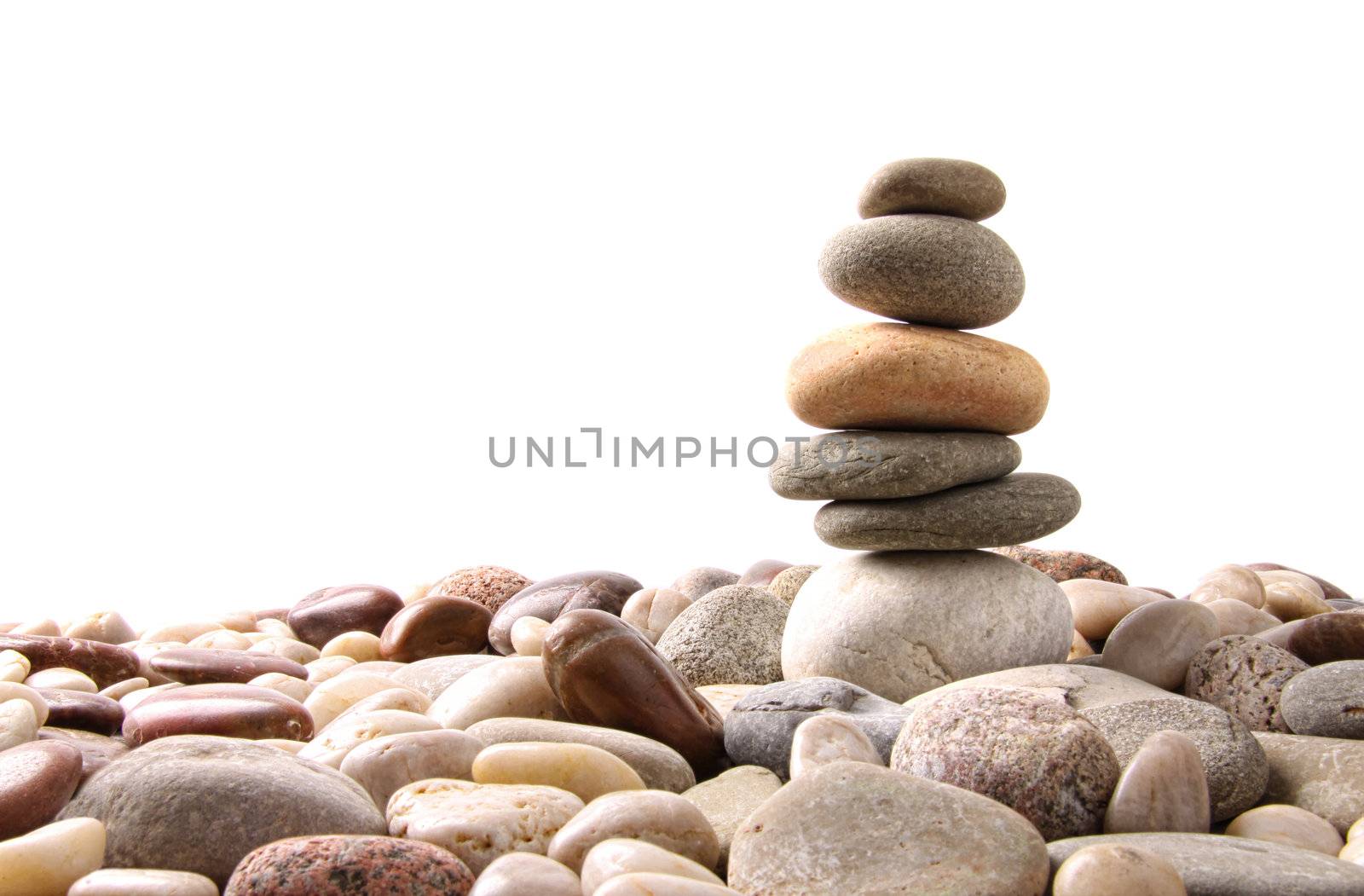 Stack of pebble stones on white background