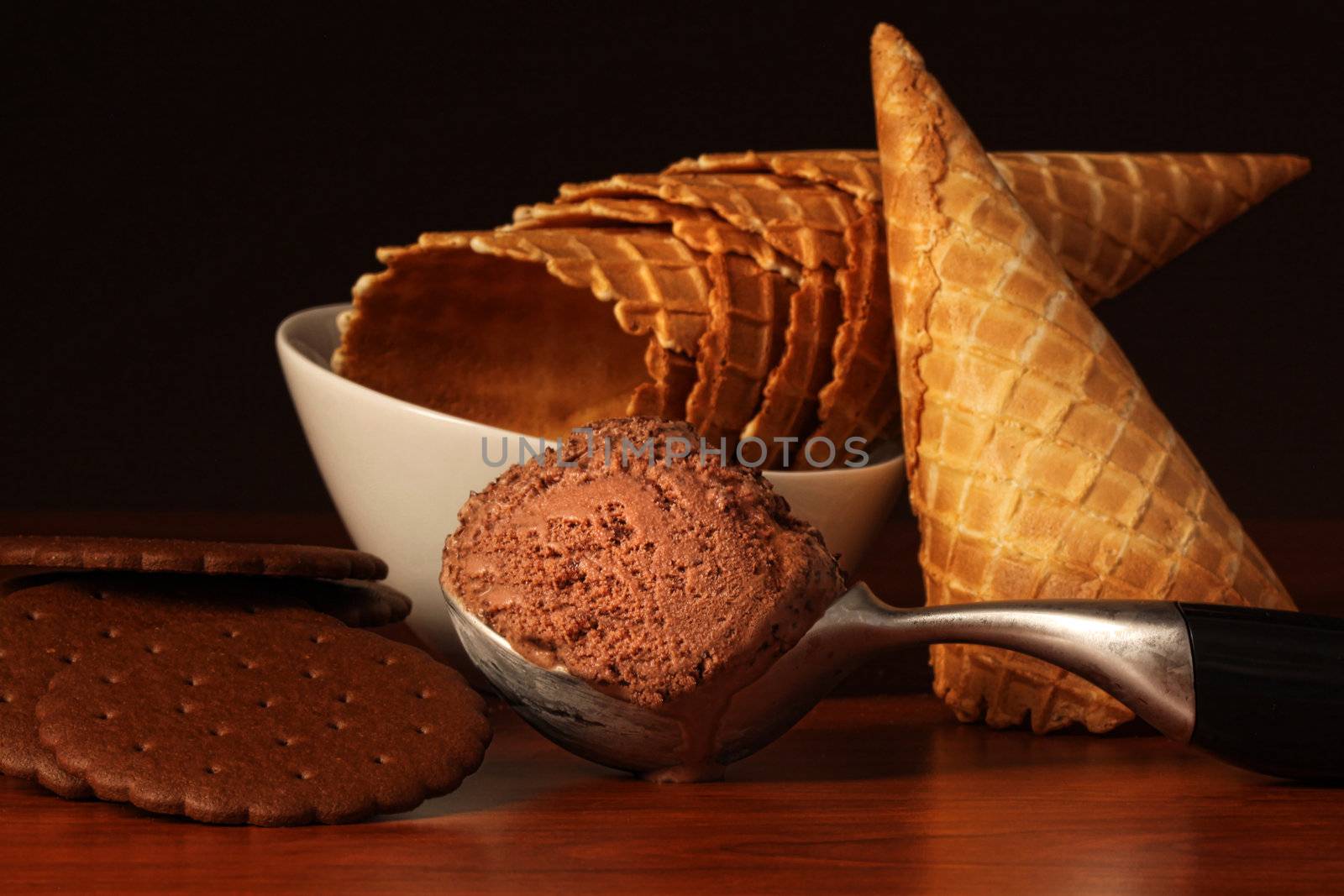 Scoop of rich chocolate ice cream with sugar cones