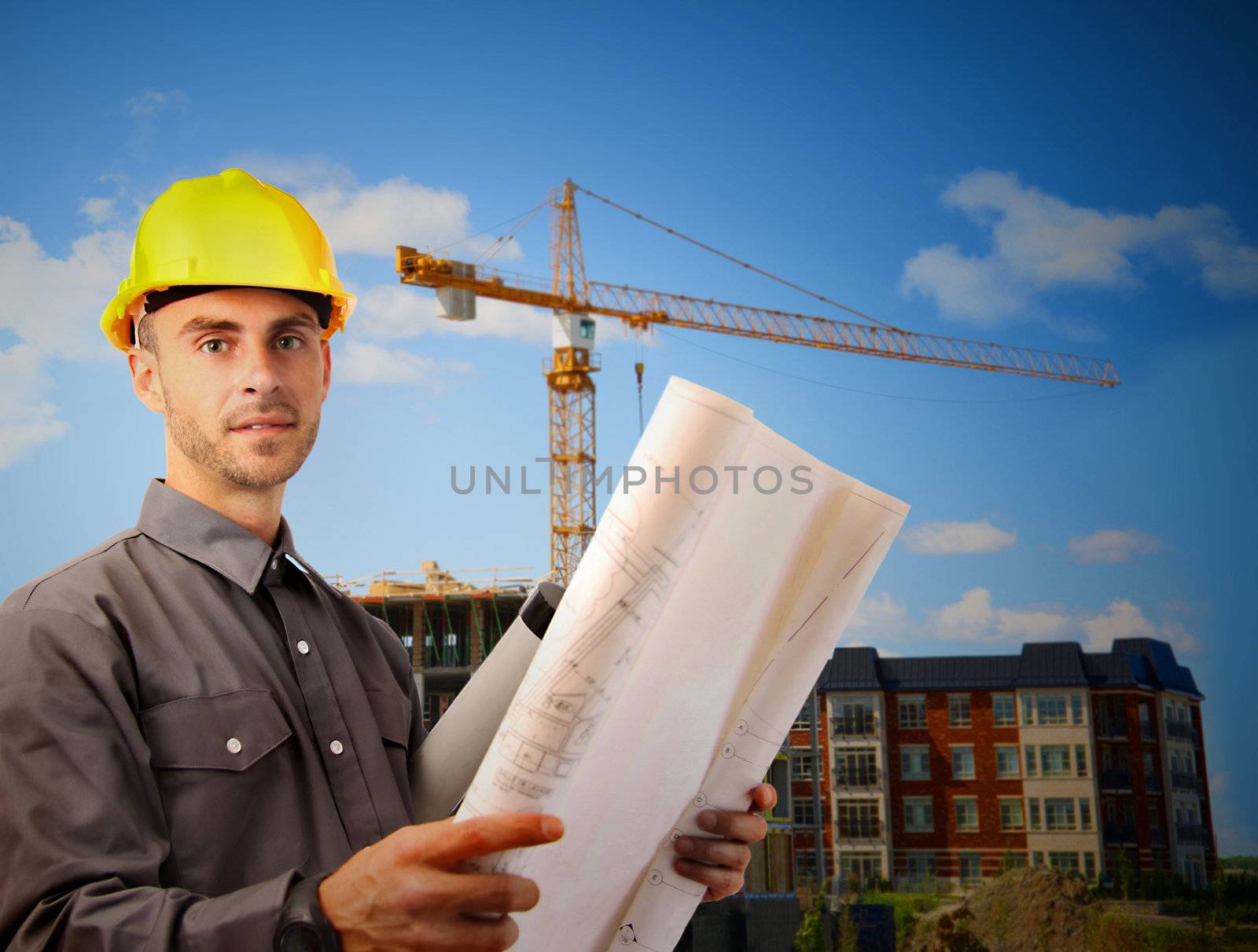 Young architect in front of  building site by Sandralise