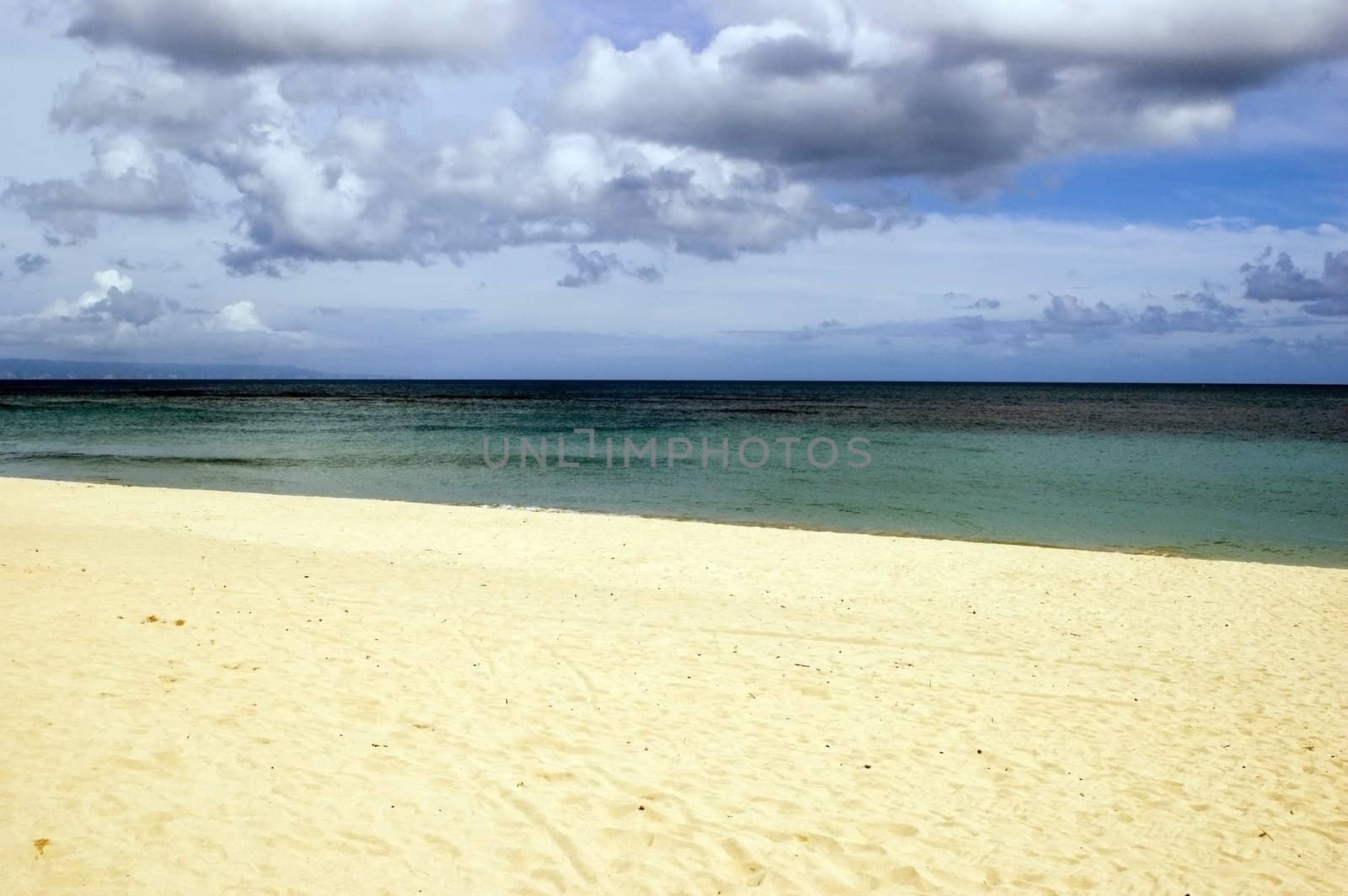 Beatiful beach in NusaDua resort, Bali Island, Indonesia. Clean sand and blue water of Indian Ocean.
