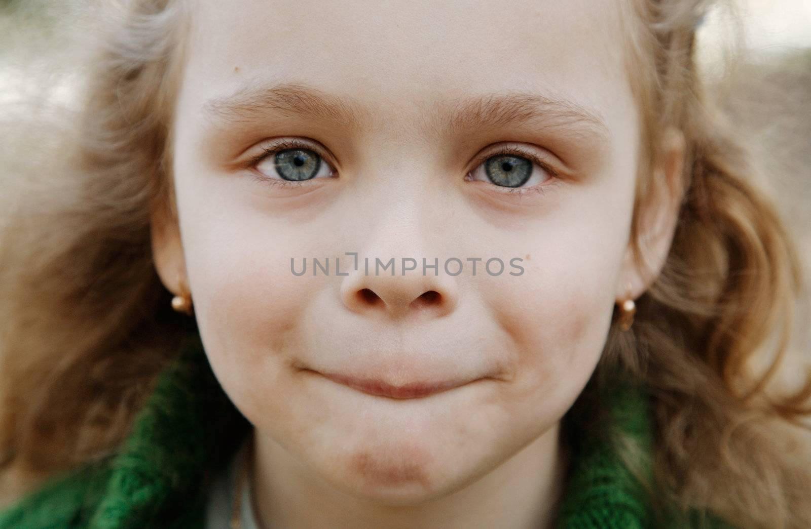 Portrait of the cheerful little girl 
