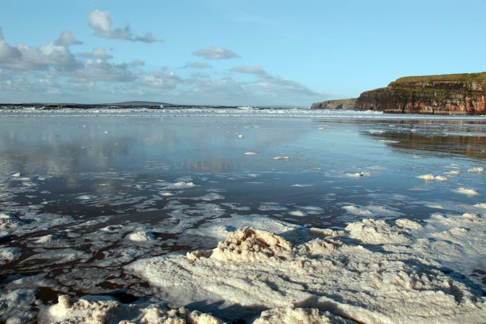 the storm waves crashing in on ballybunion beach ireland