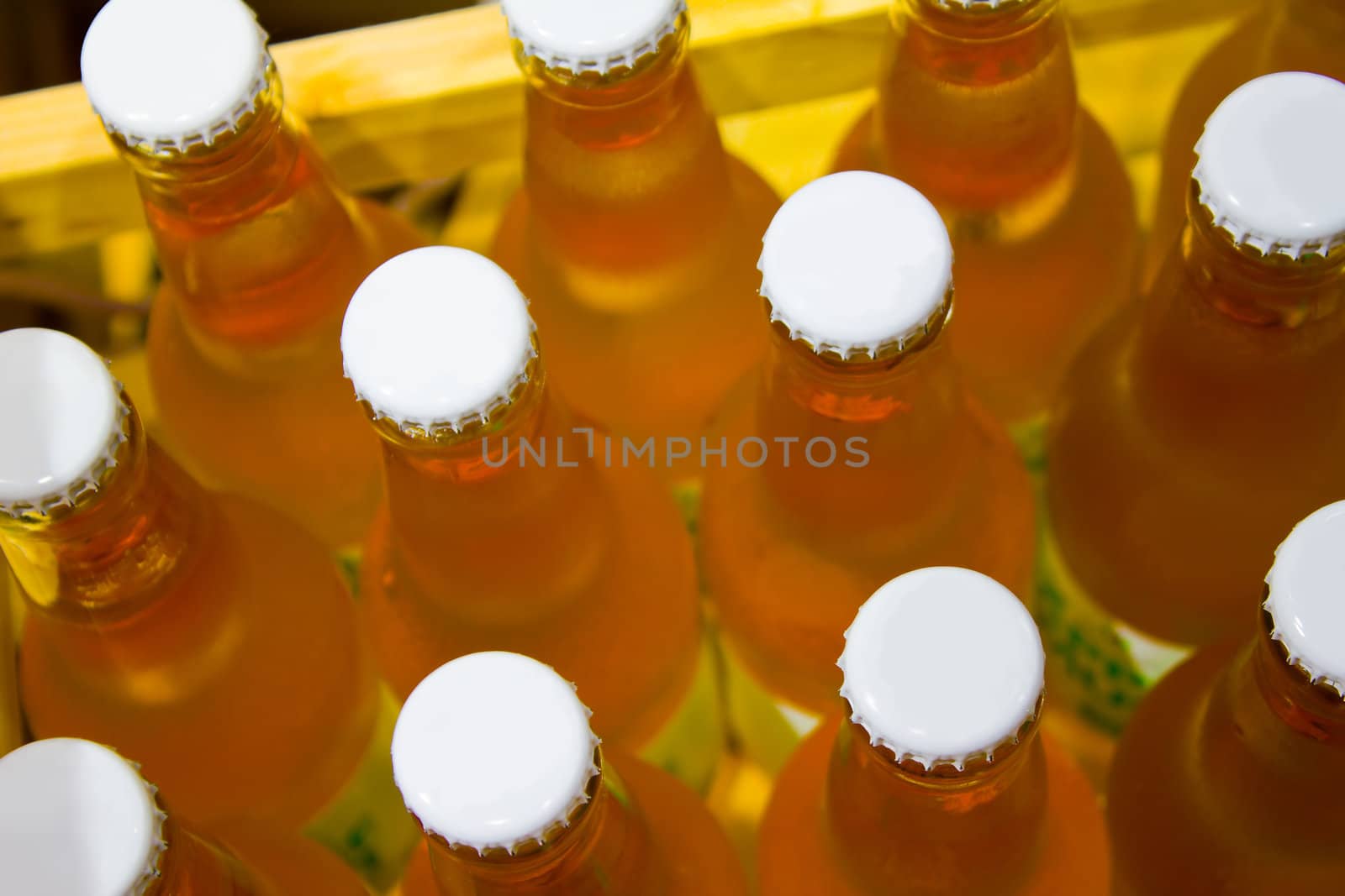 Fresh wooden case full of unopened cider bottles