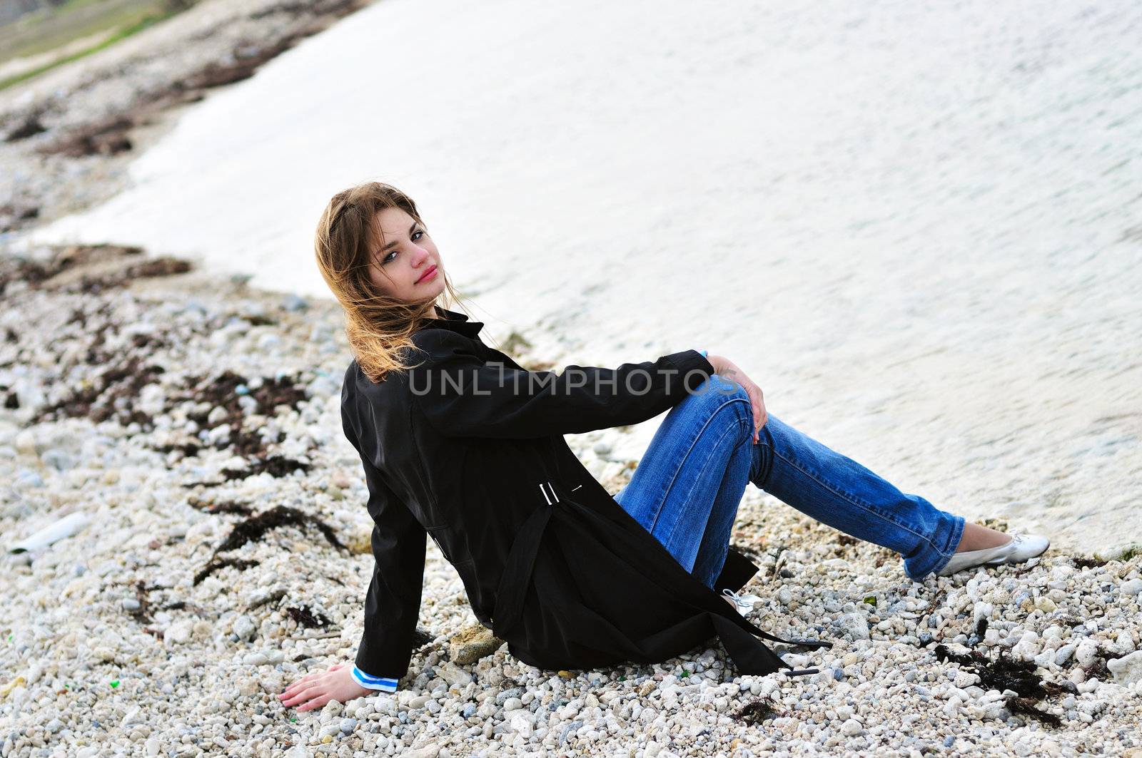 pensive girl on the beach by Reana