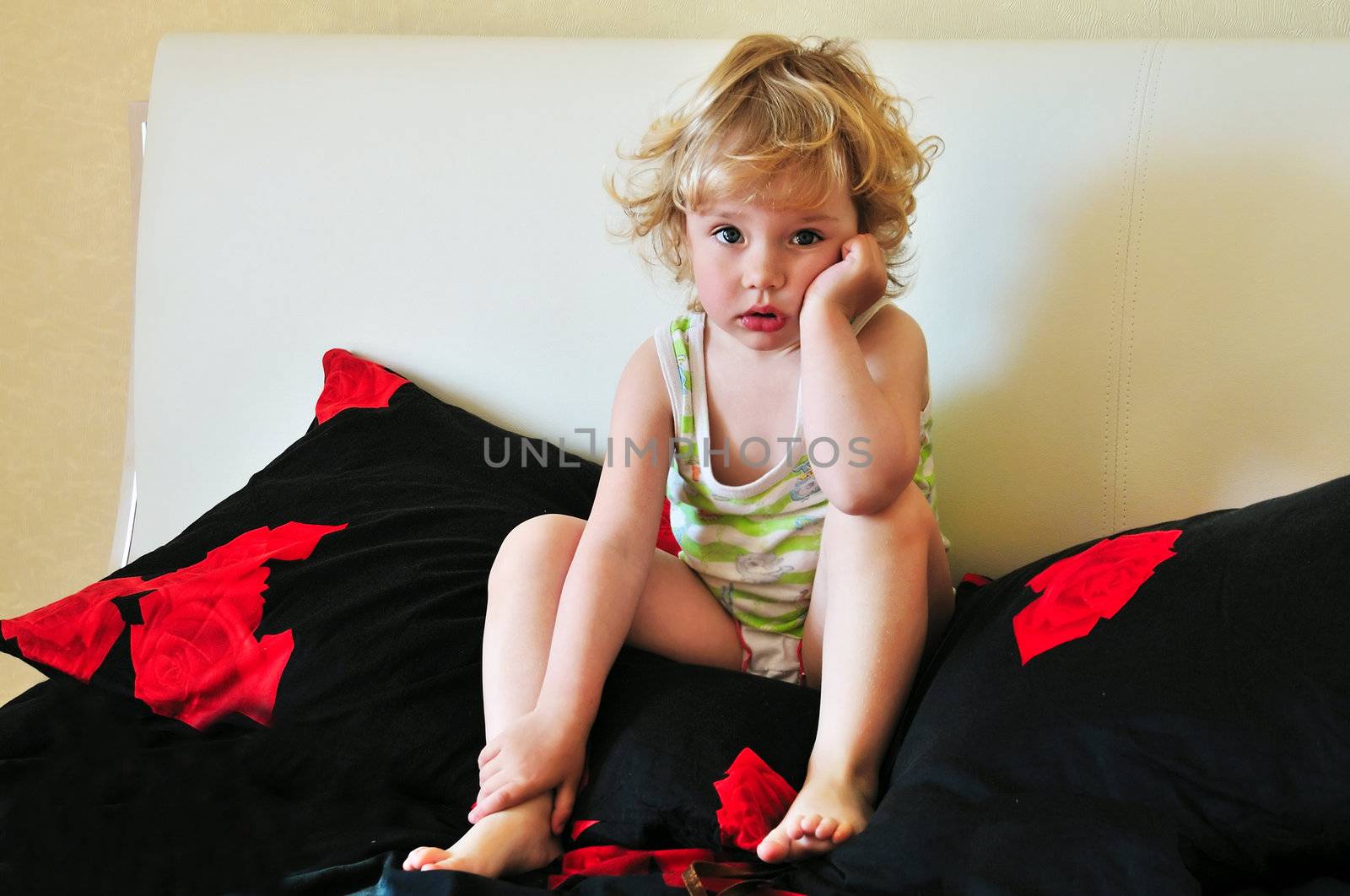 little girl has already woken up and waiting for mother