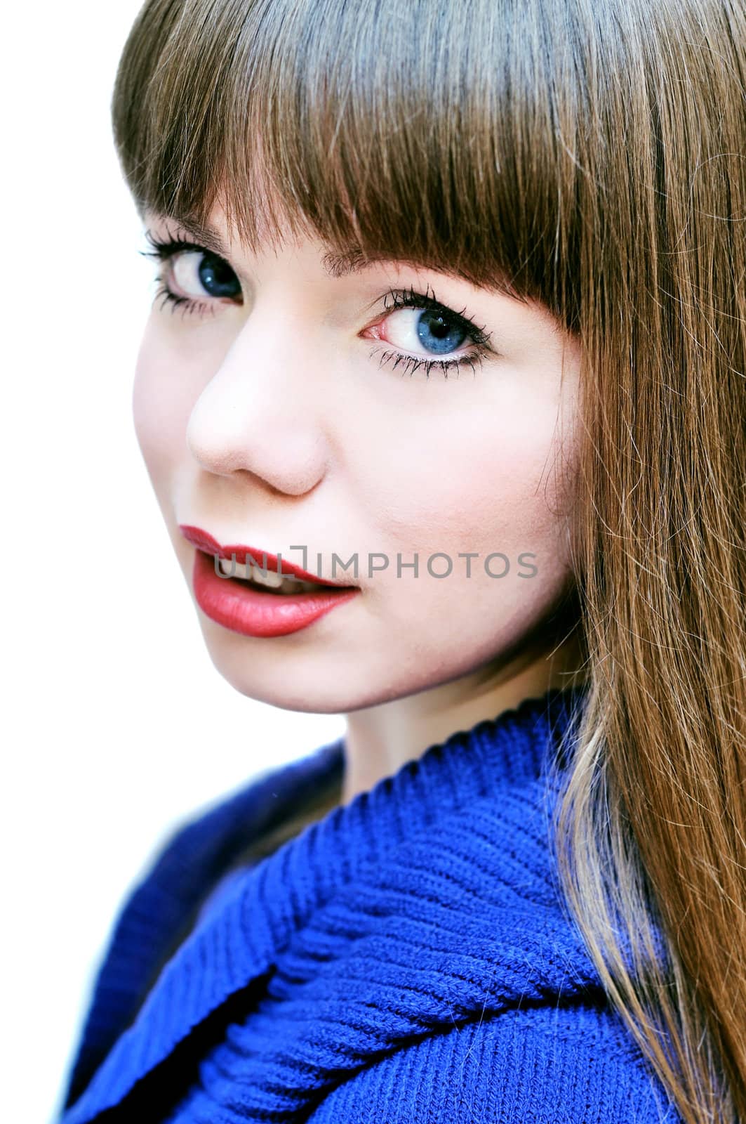 face of blue-eyed beautiful girl wearing sweater