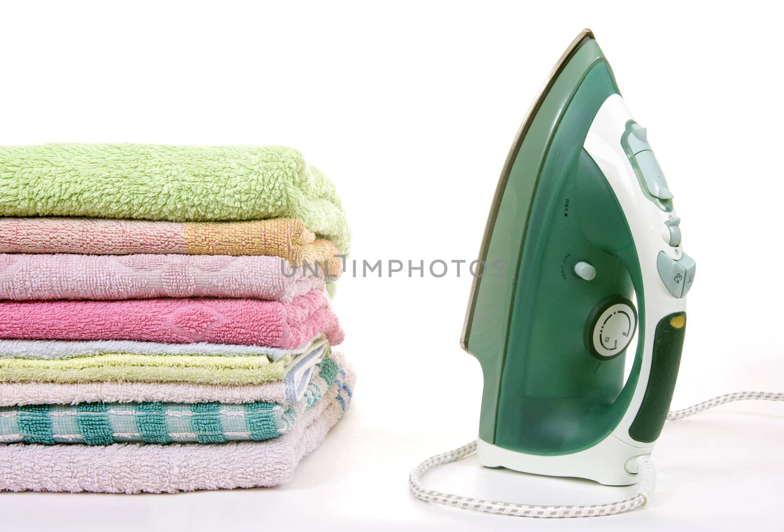 iron and towels on a white background