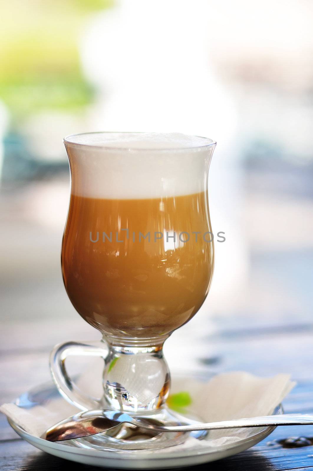cup of latte in the outdoors cafe