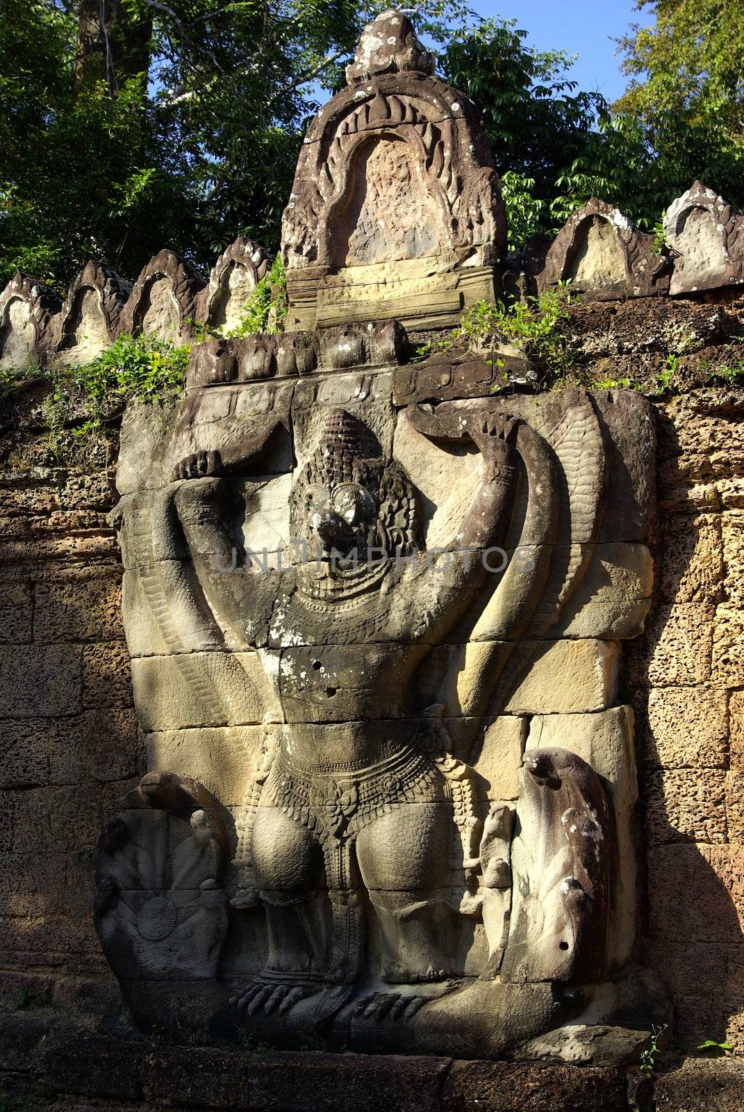 It's a view of one of Cambodian god engraved on a temple wall in Angkor