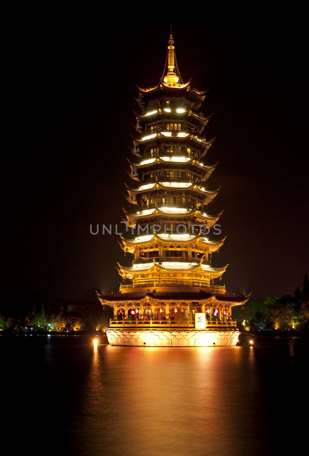 Guilin: Golden Pagode in the lake. by Claudine