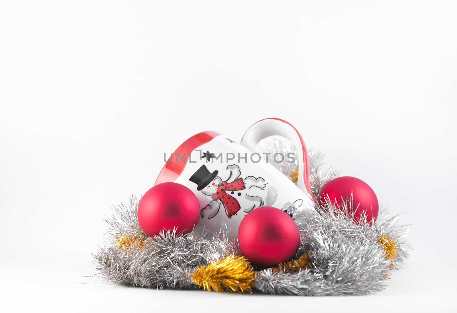 Christmas Mug with Snowman, tinsel and baubles on a white background