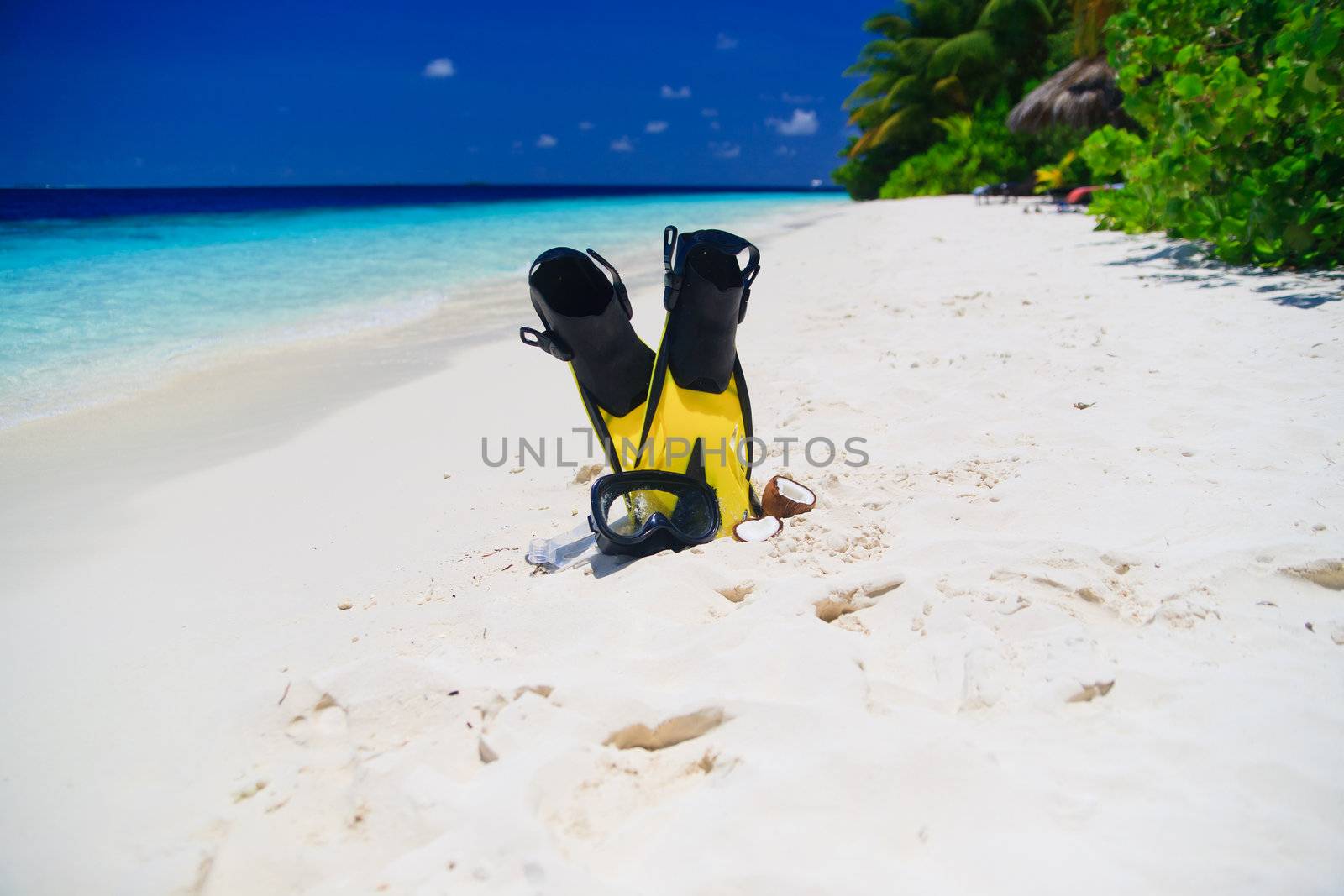 snorekl equipment on white sand beach at Maldives