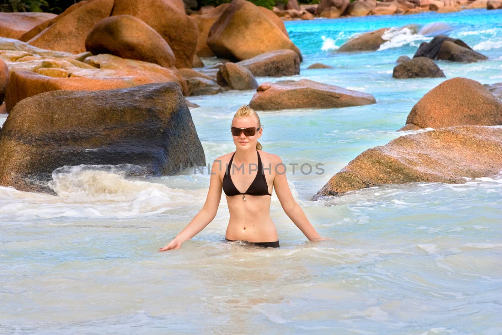 young woman on beach at Seychellen