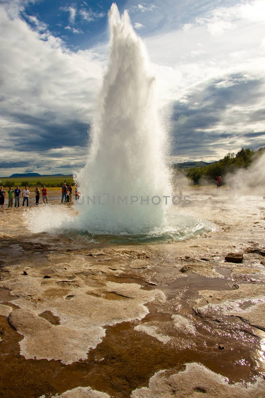 Beauty strokkur in Geysir area. Sunny summer day. Iceland