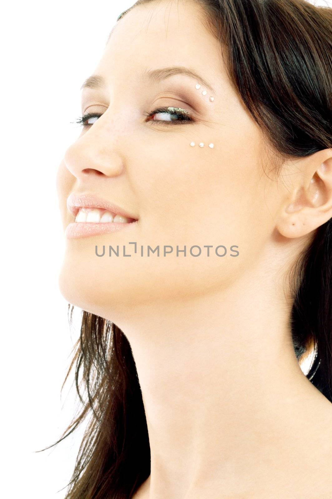 portrait of smiling brunette with diamond make-up