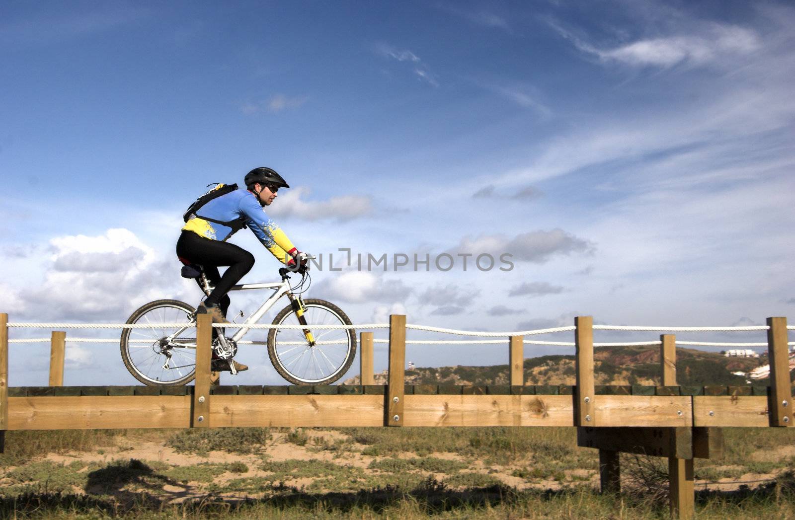 Man riding a bike in a beautiful day