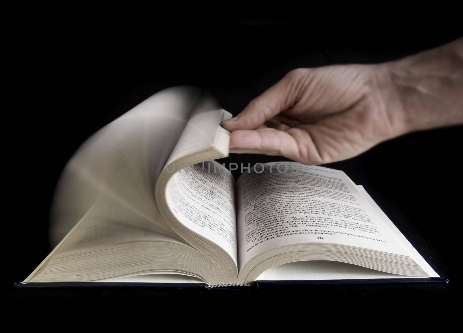 Man hand defoliate a book
