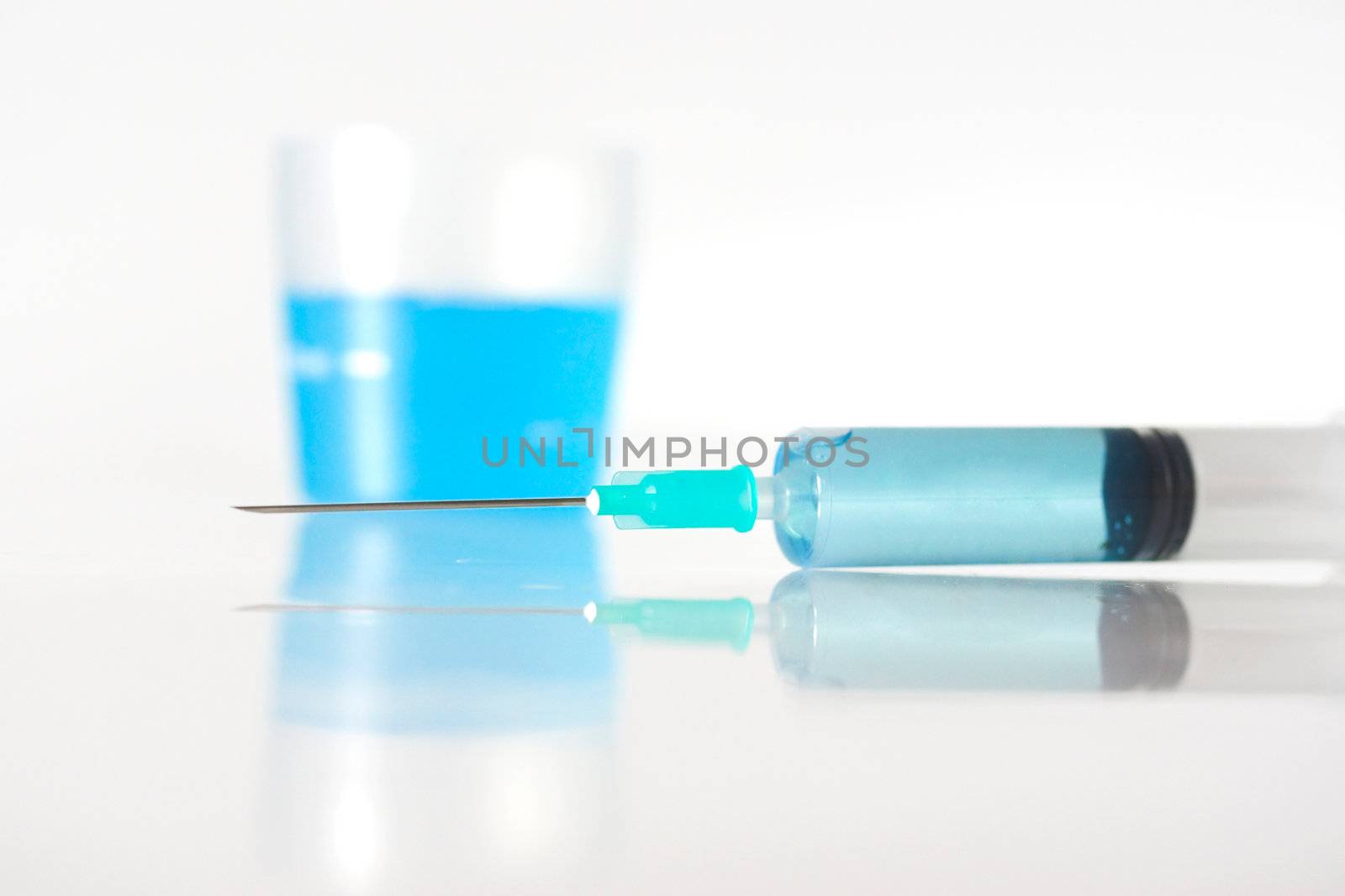 Syringe with blue liquid