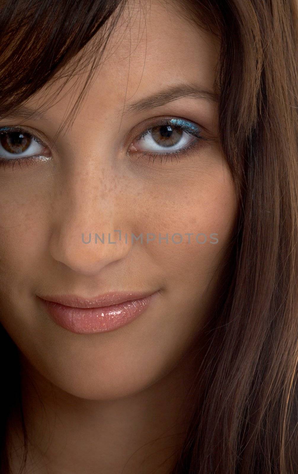 closeup portrait of smiling brunette with long hair