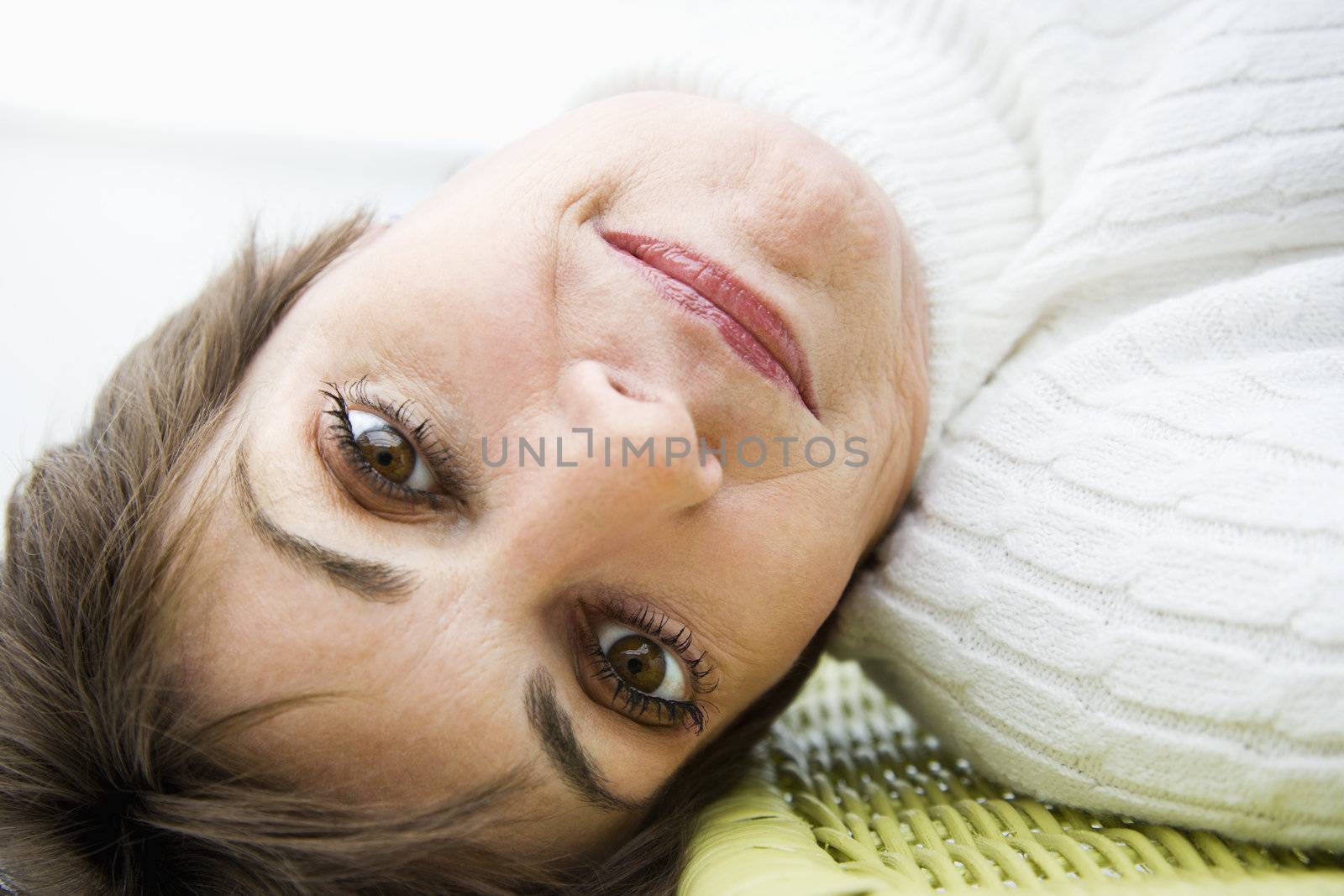 Head and shoulder portrait of pretty Caucasian woman.