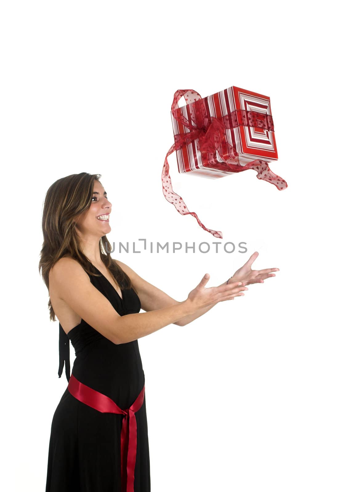 Happy woman isolated on a white background sending a the present to the air