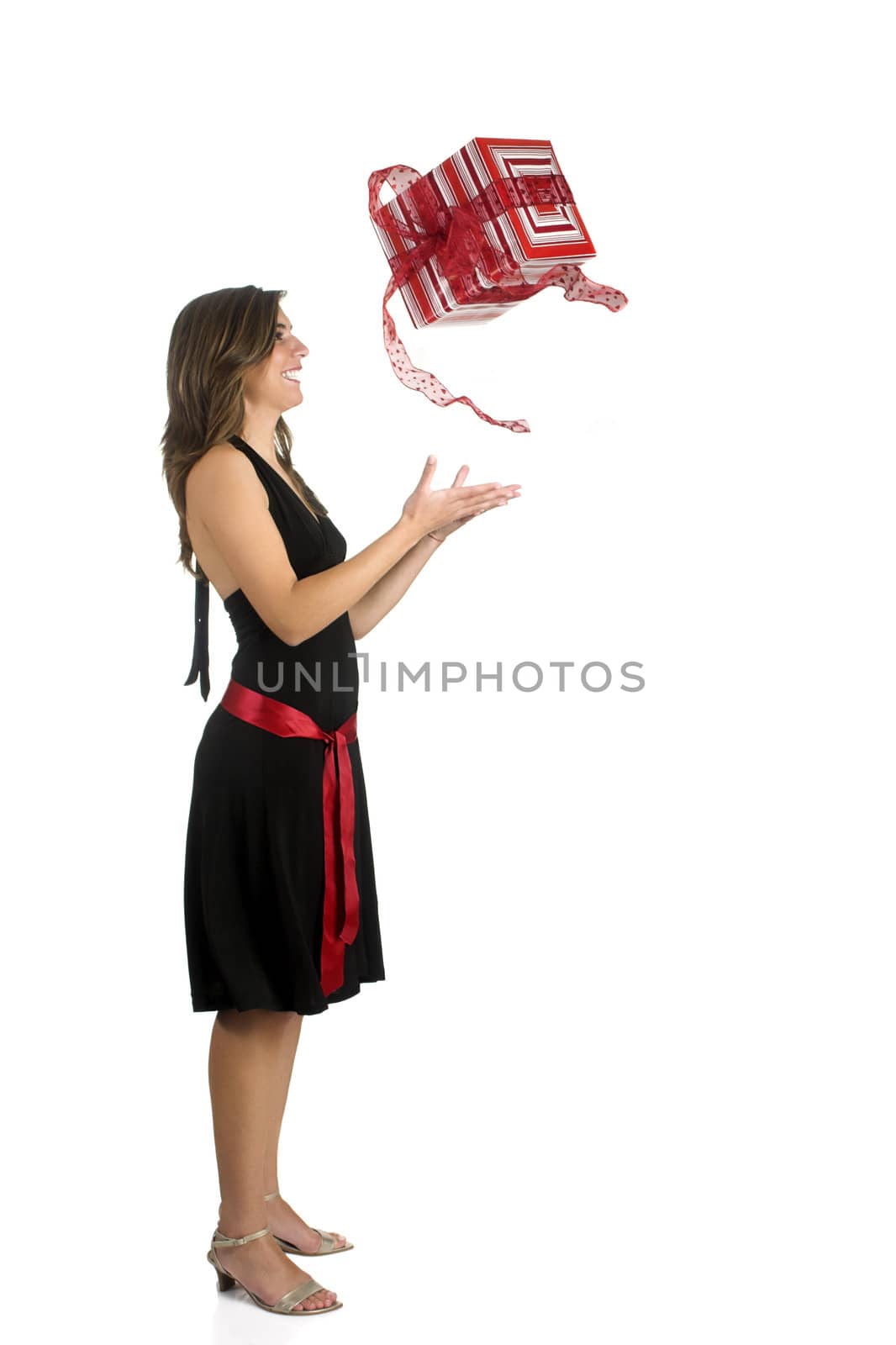Happy woman isolated on a white background sending a the present to the air