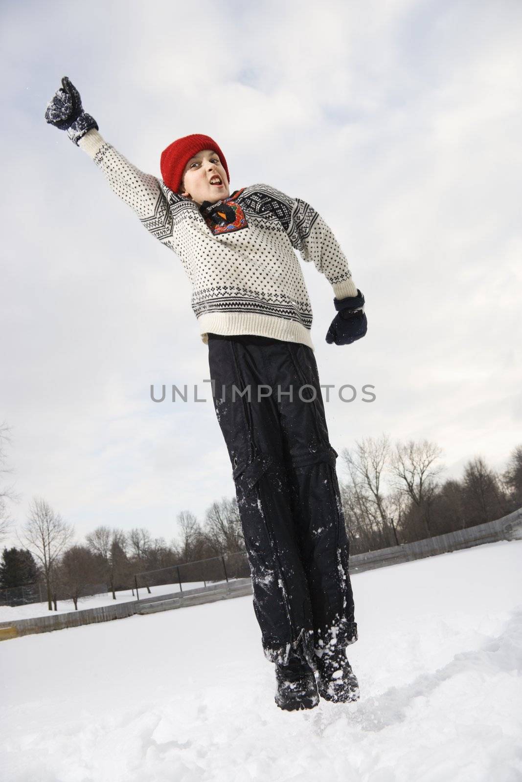 Boy jumping in air. by iofoto