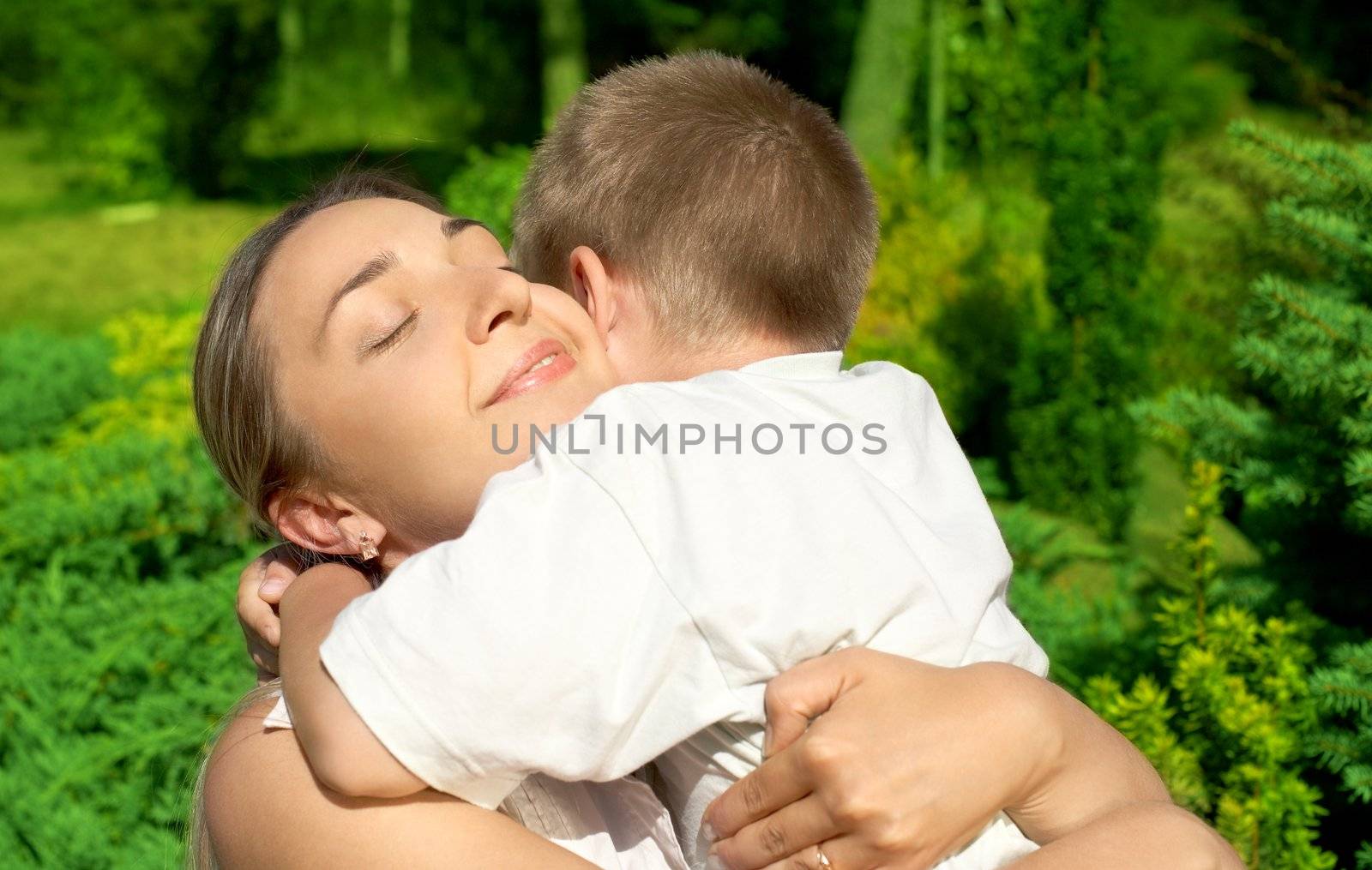 outdoor picture of happy mother with son
