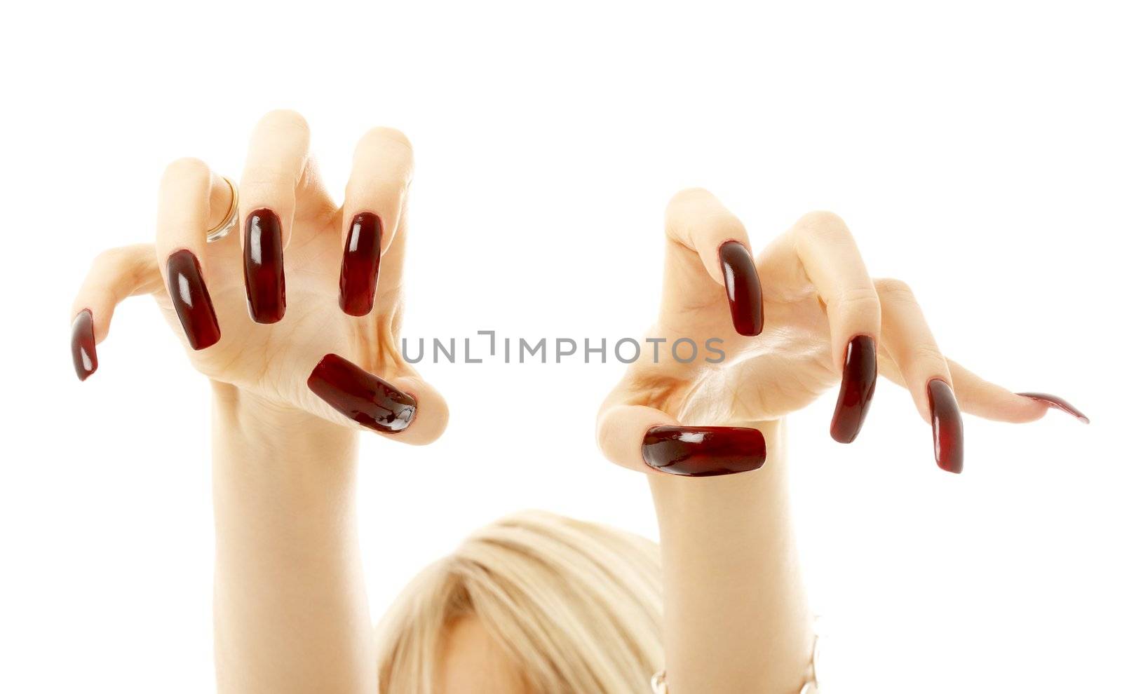 aggressive girl hands with long acrylic nails over white
