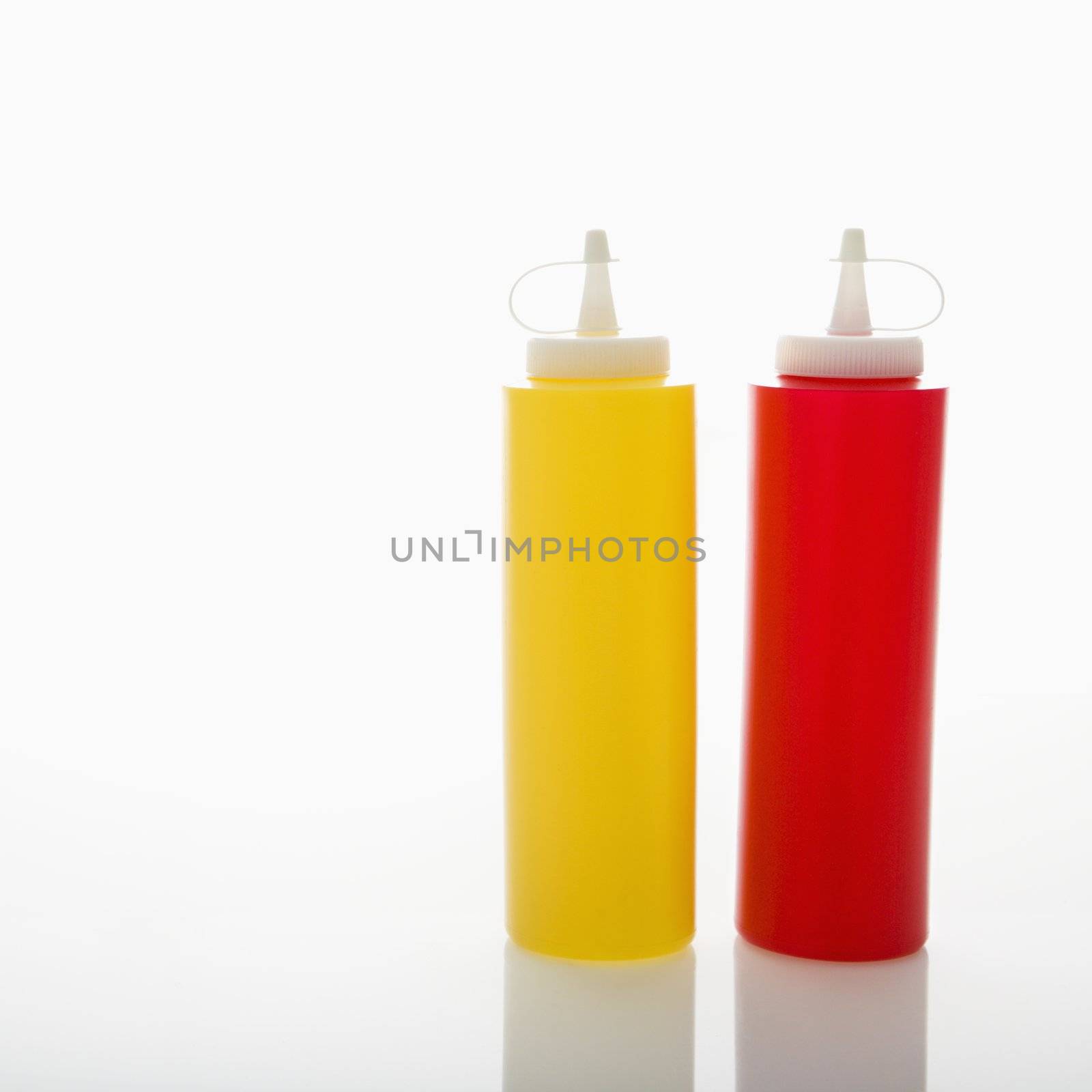 Plastic ketchup and mustard containers.