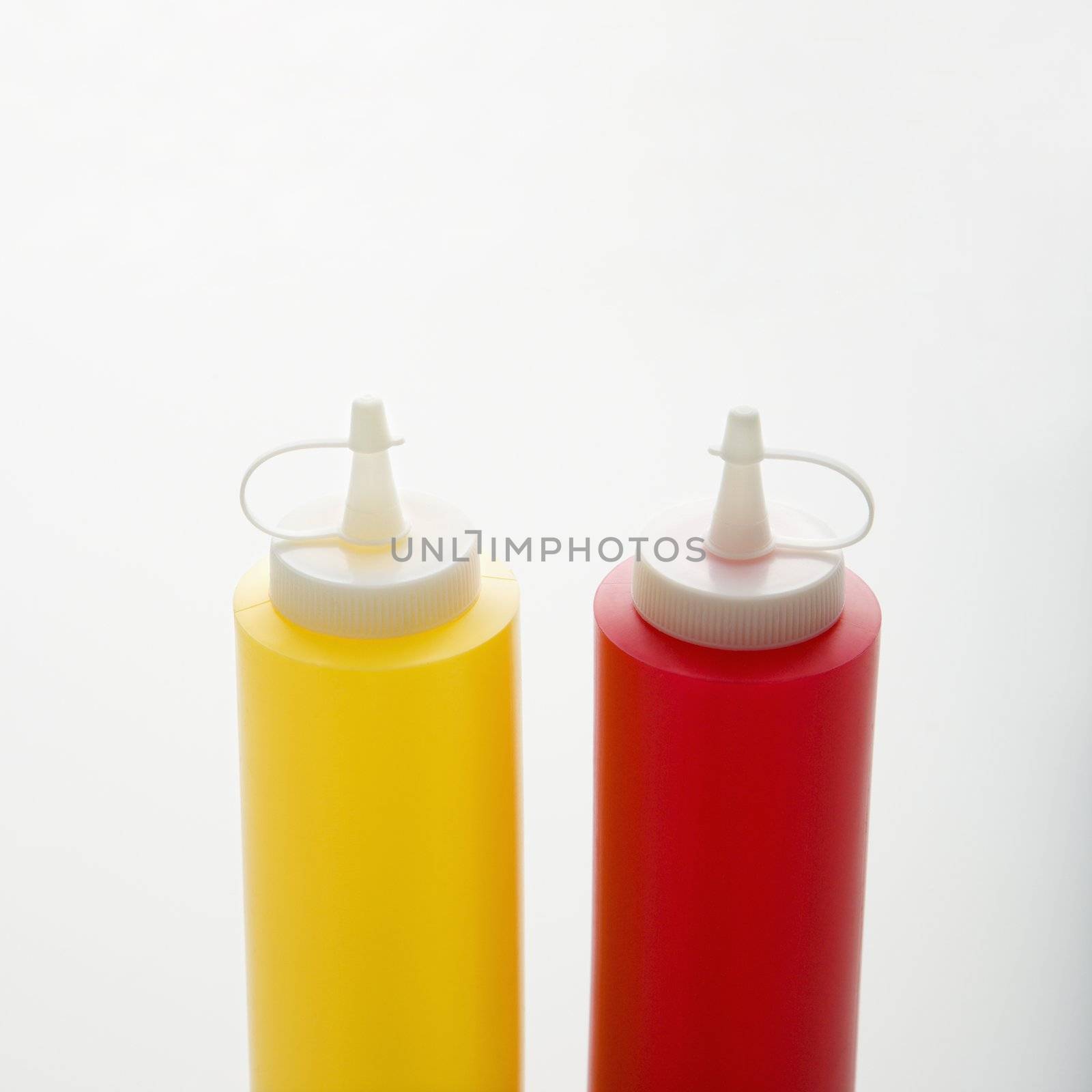 Plastic ketchup and mustard containers.