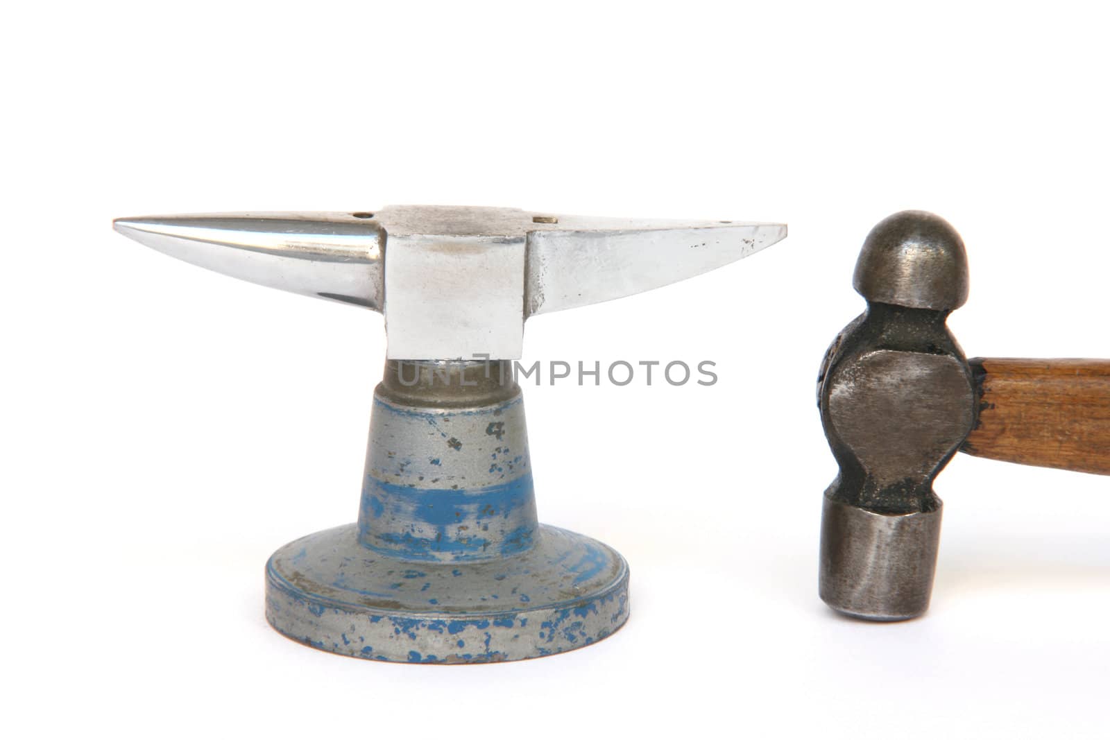 small anvil and hammer from jewelry manufacture isolated