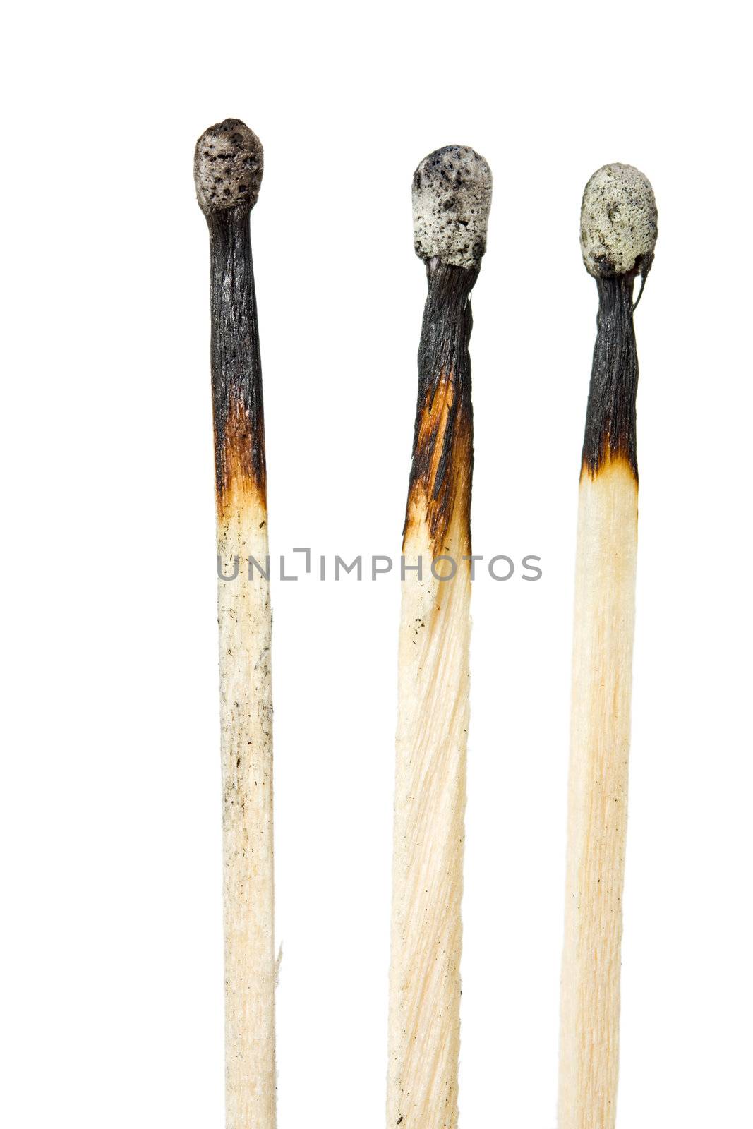 three burned matches isolated on white background