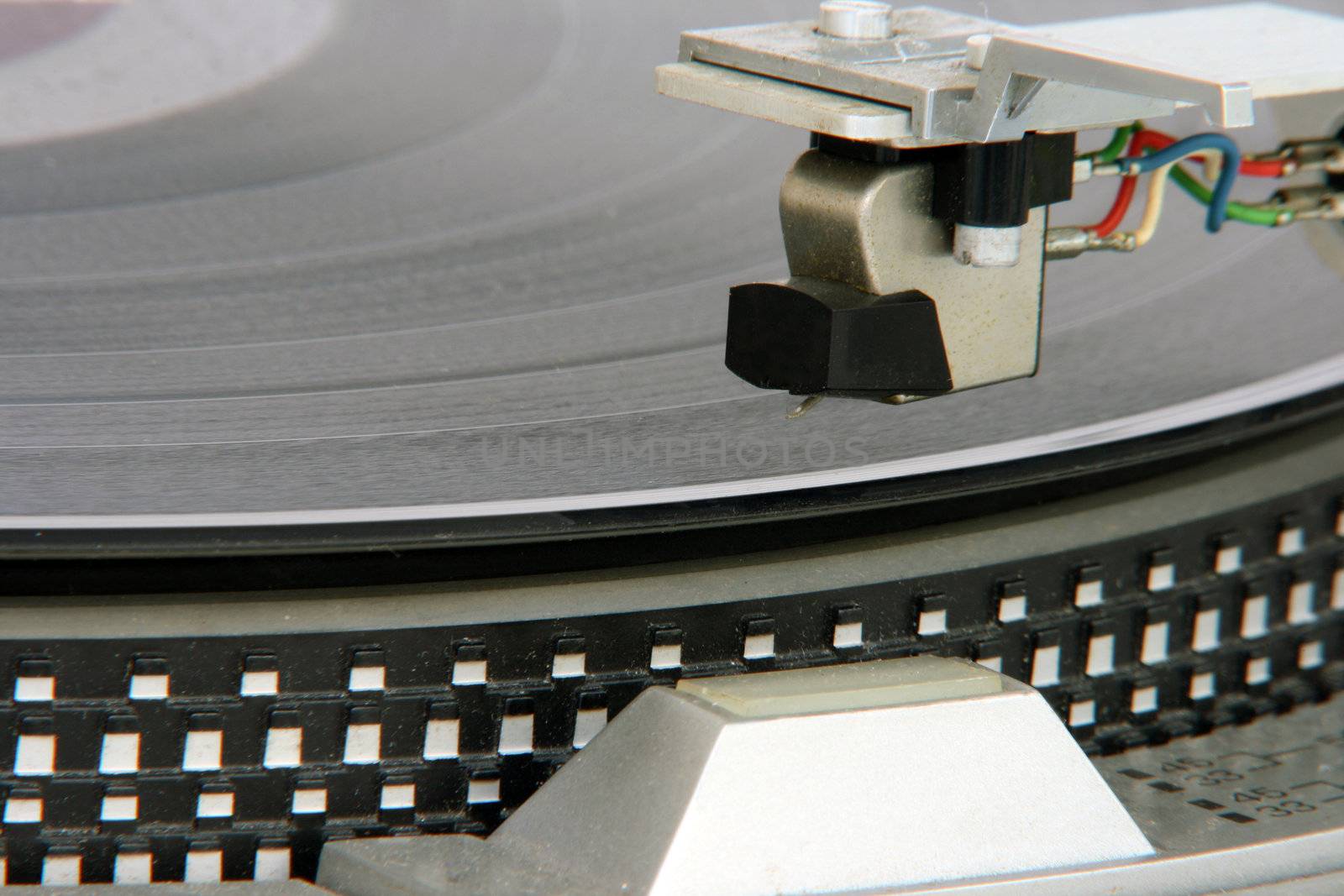 closeup of old turntable with long play vinyl
