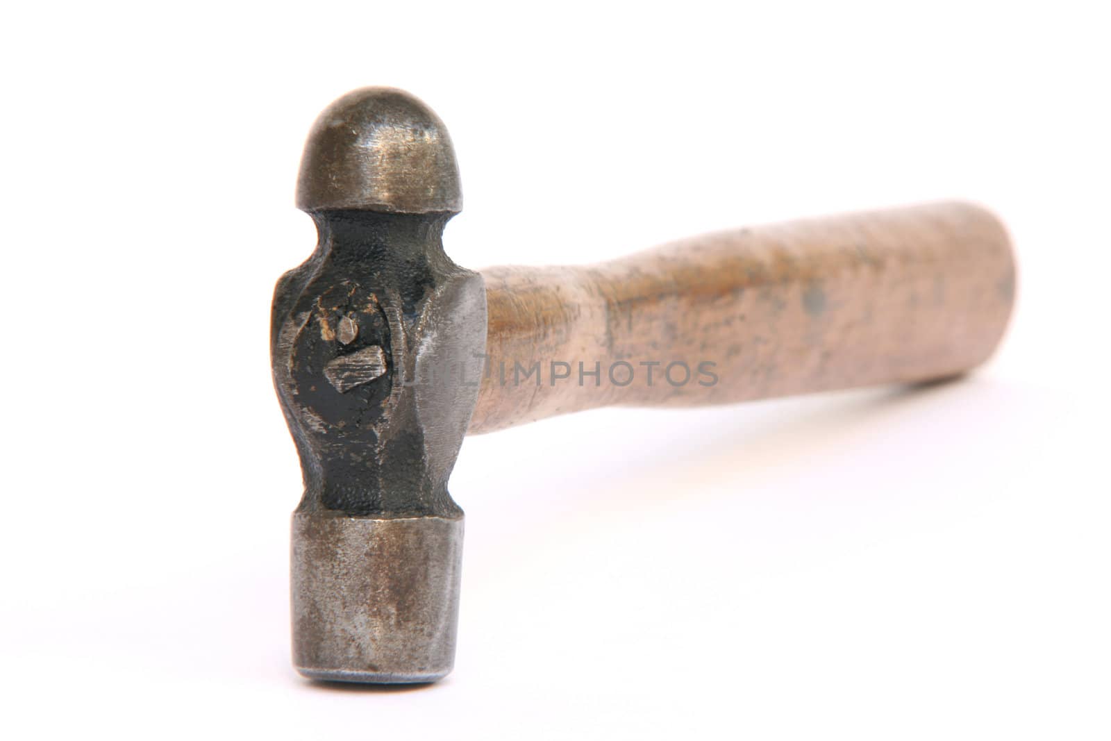 close up of an old wooden hammer isolated on white background