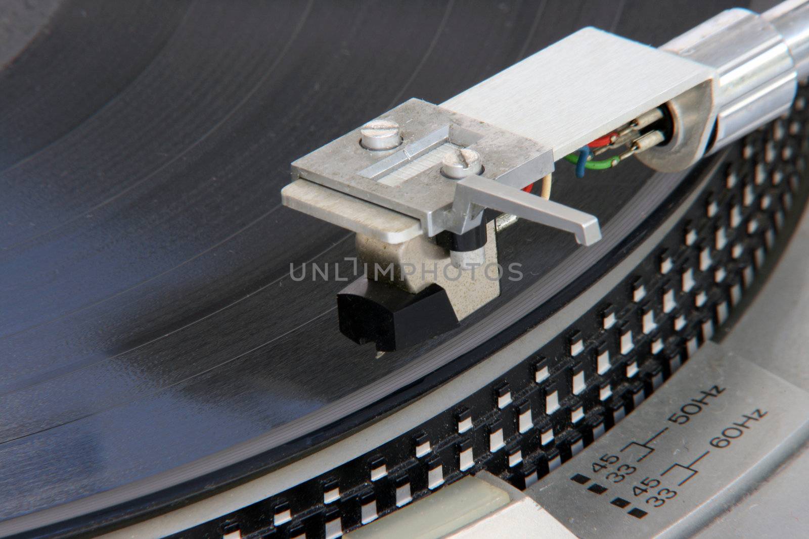 closeup of old turntable with long play vinyl