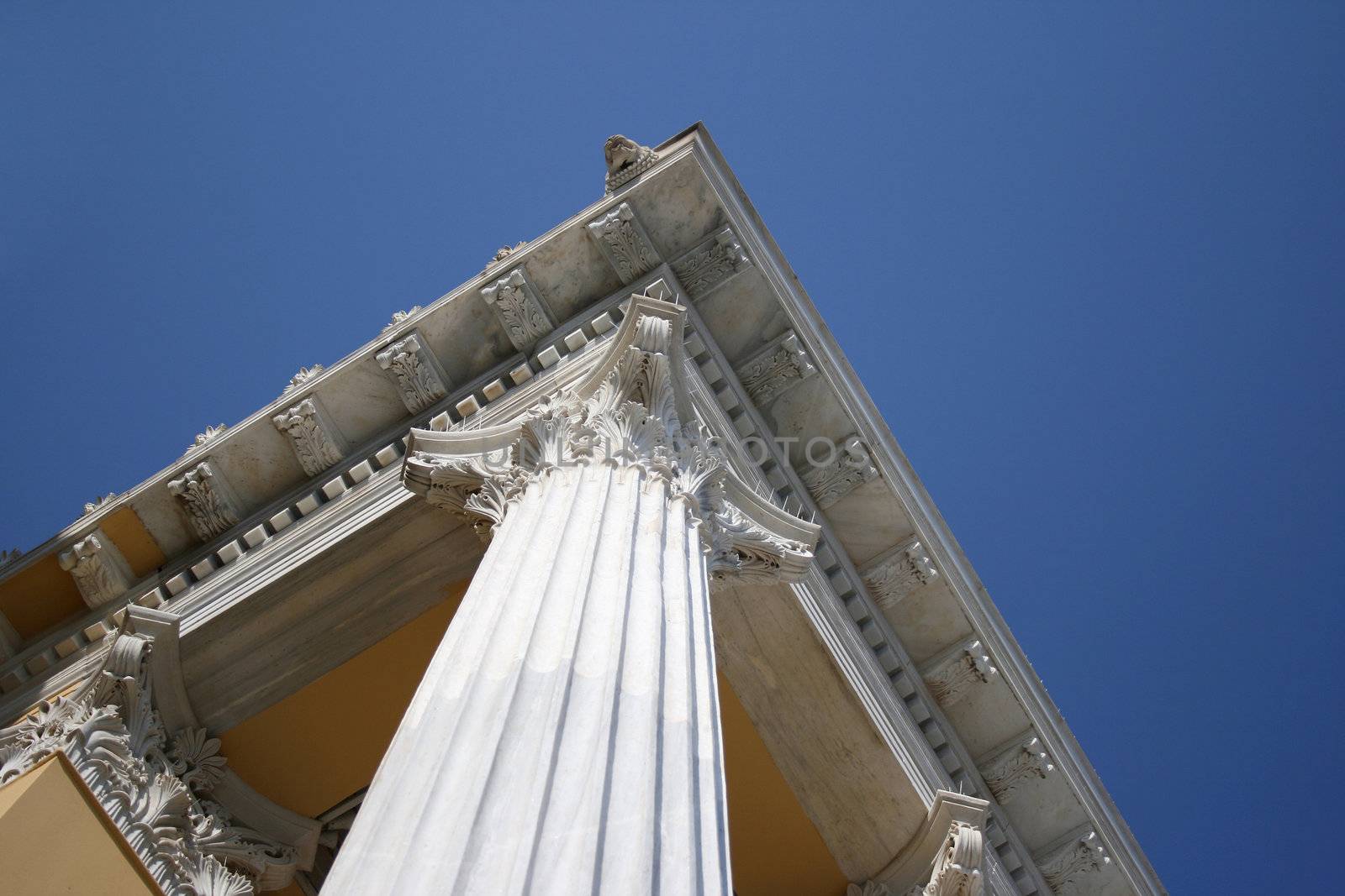 roof detail and pillars and blue sky from zapeion building landmarks of athens greece