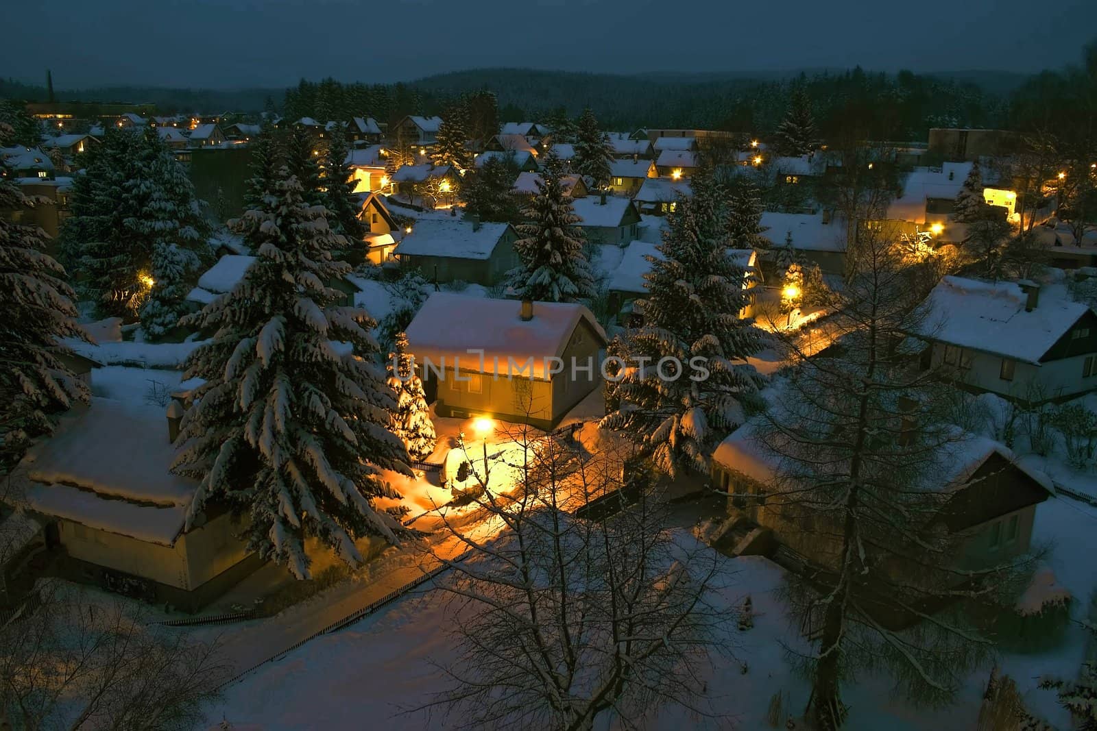 View to a night village covered with snow