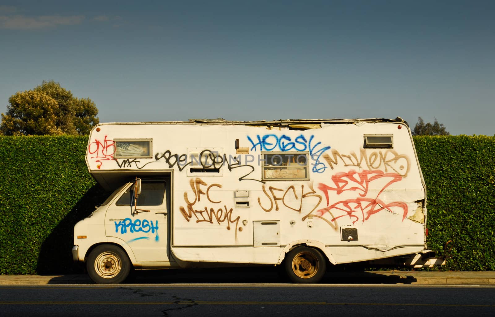 side view of graffiti covered motorhome