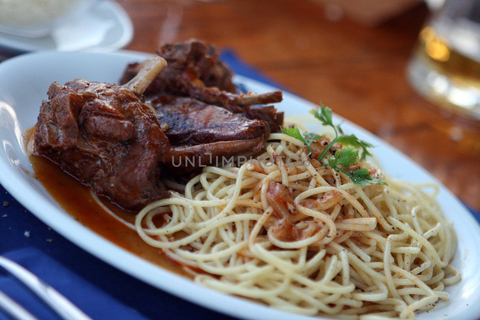 lamp meat with spaghetti and red tomato sauce closeup