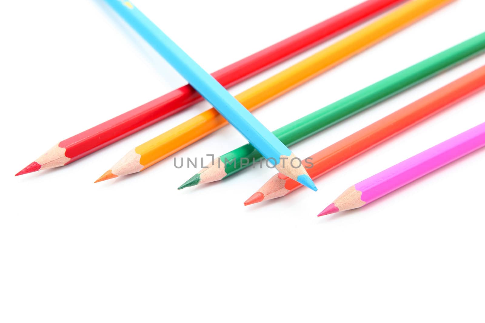 six color pencils isolated on white background with copyspace