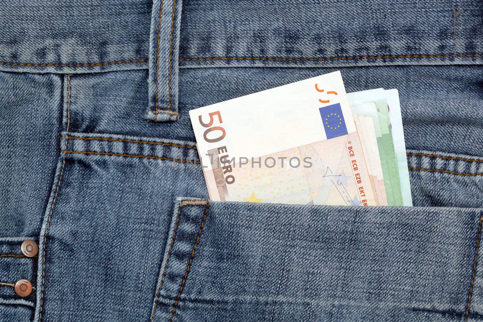 blue jean and fifty euro banknotes