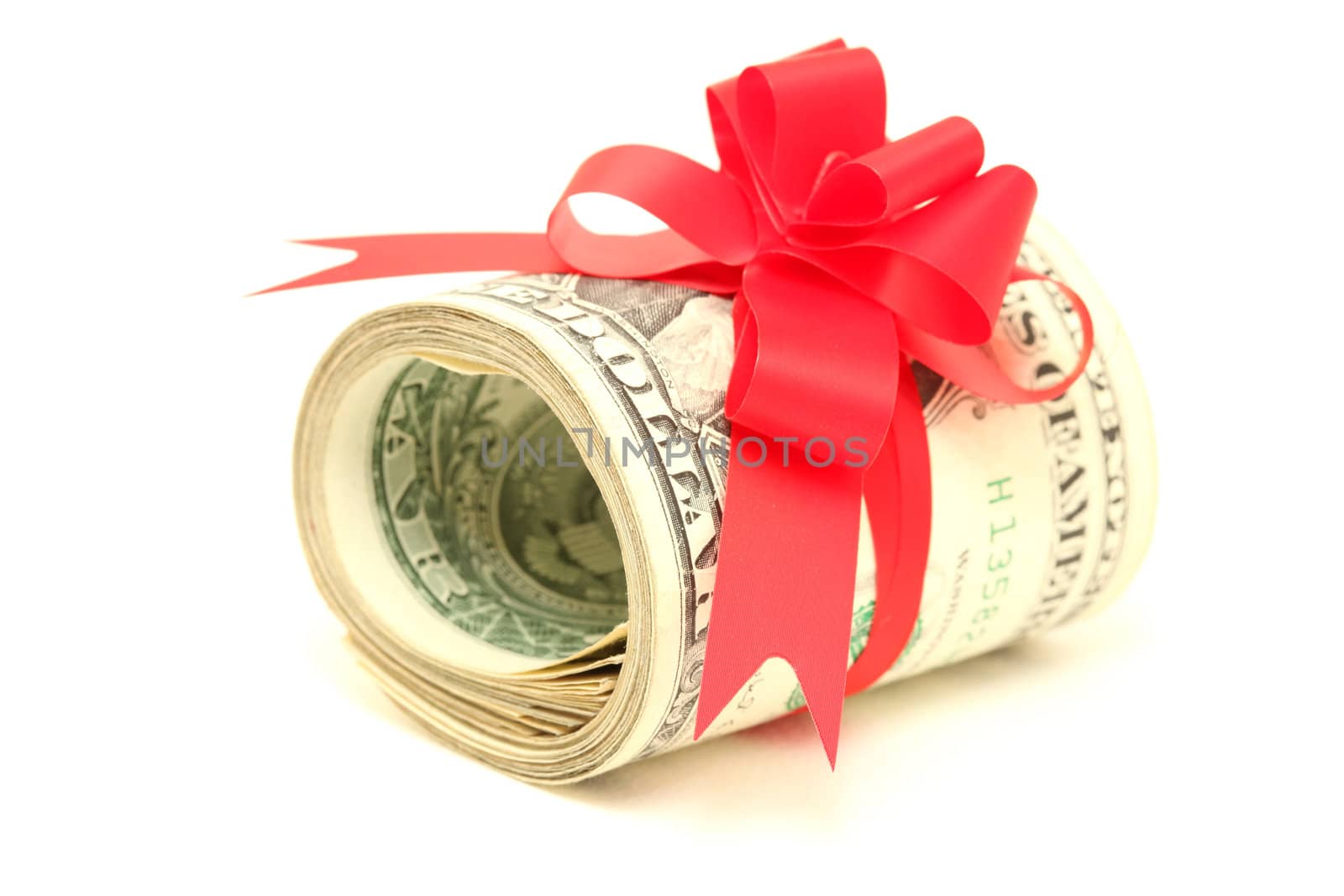 present of roll of dollars with red ribbon bow isolated