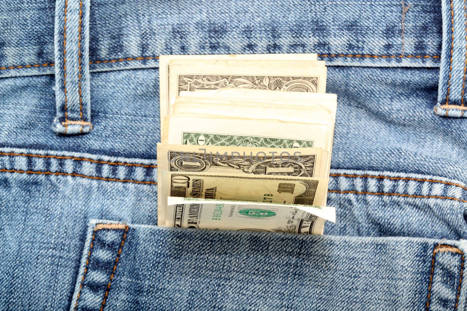 american dollar banknotes in jeans pocket focus on money