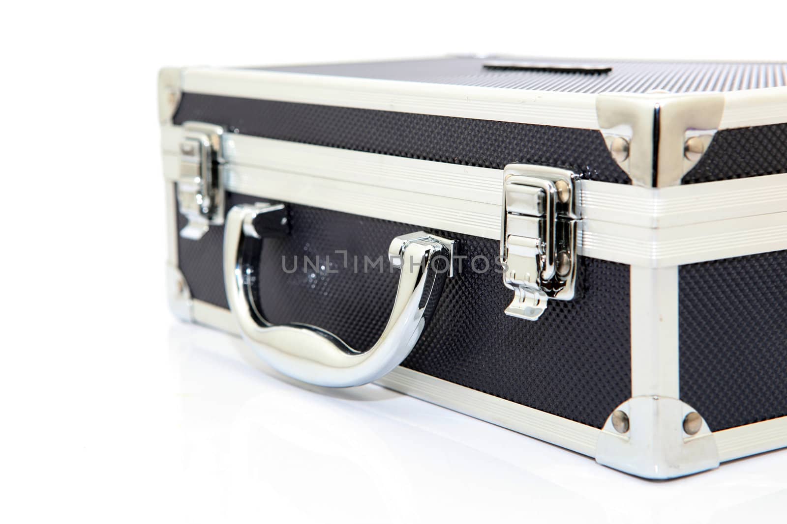 closeup of black aluminum briefcase isolated on white background