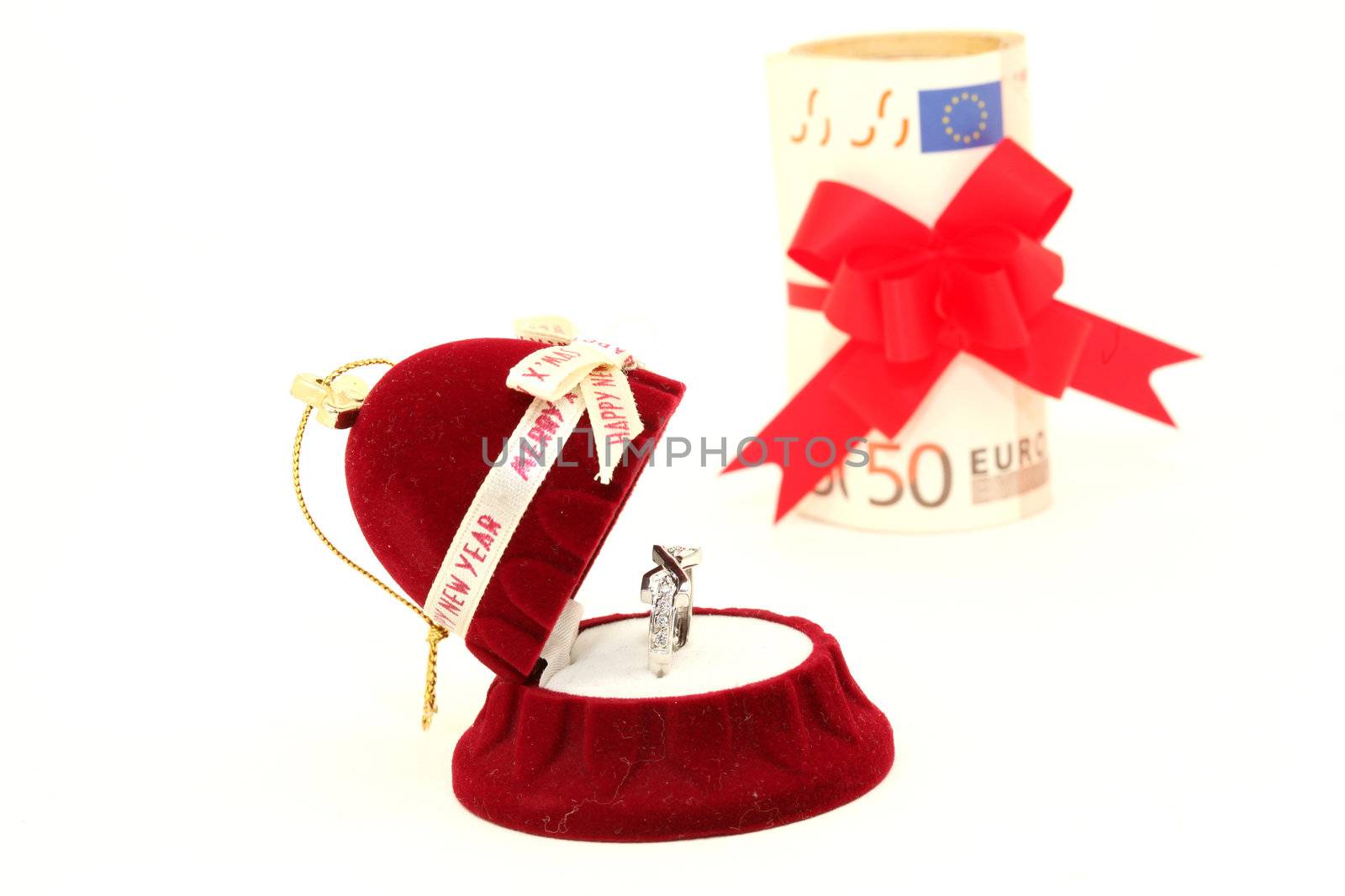 xmas gift box with white gold ring and euro money background isolated