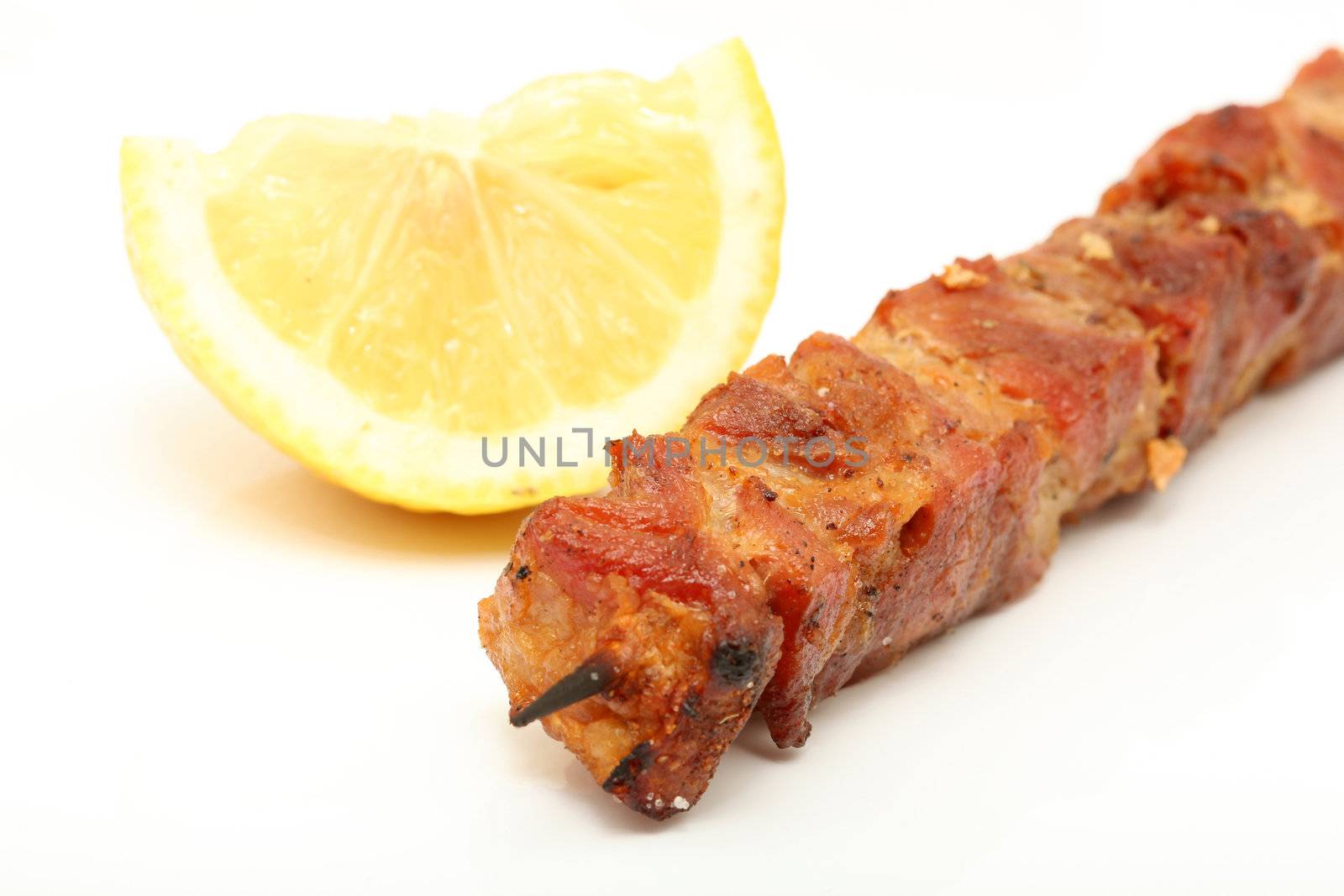 macro lemon and pork kebap  grilled isolated 