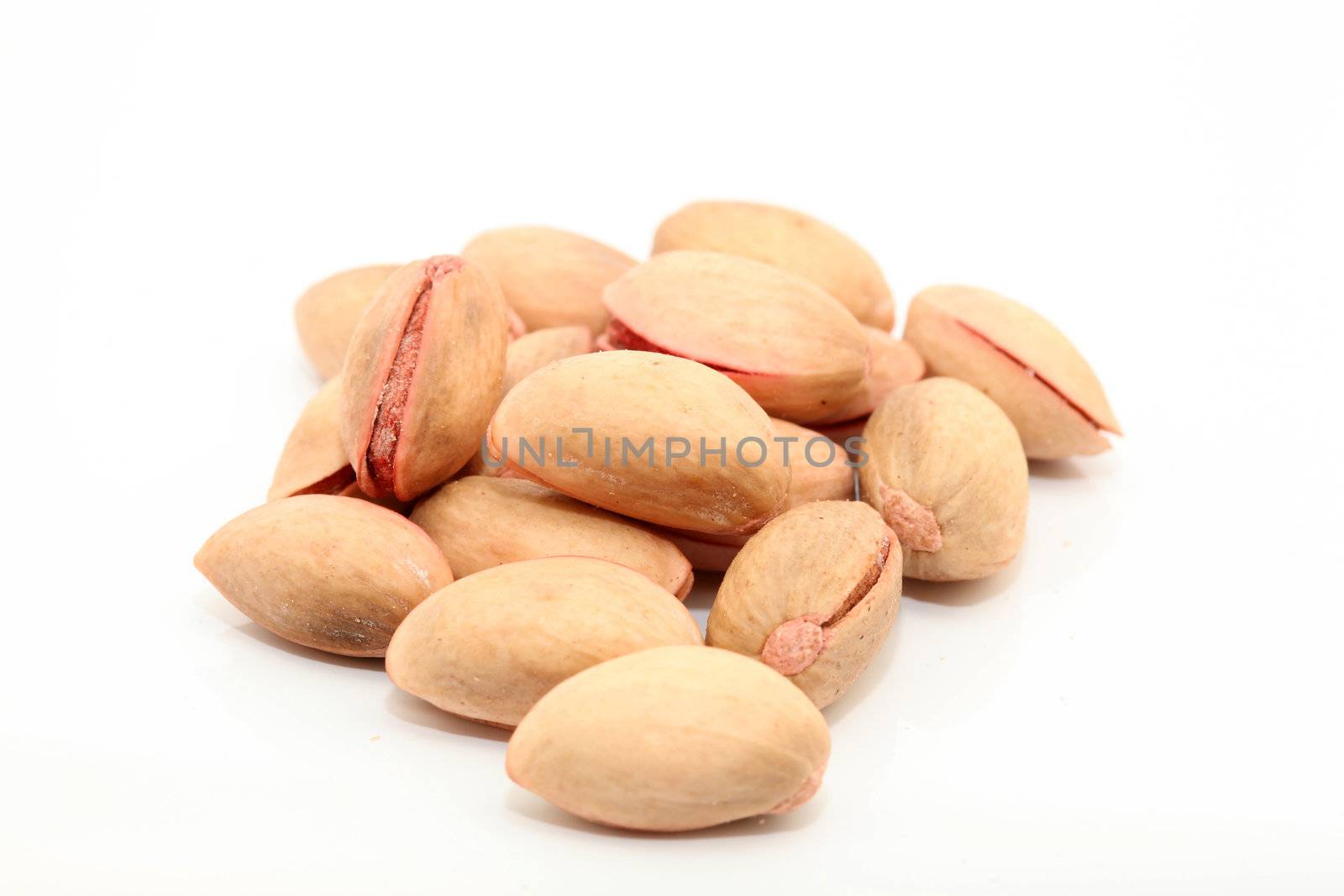 stack of salty pistachios isolated with copyspace
