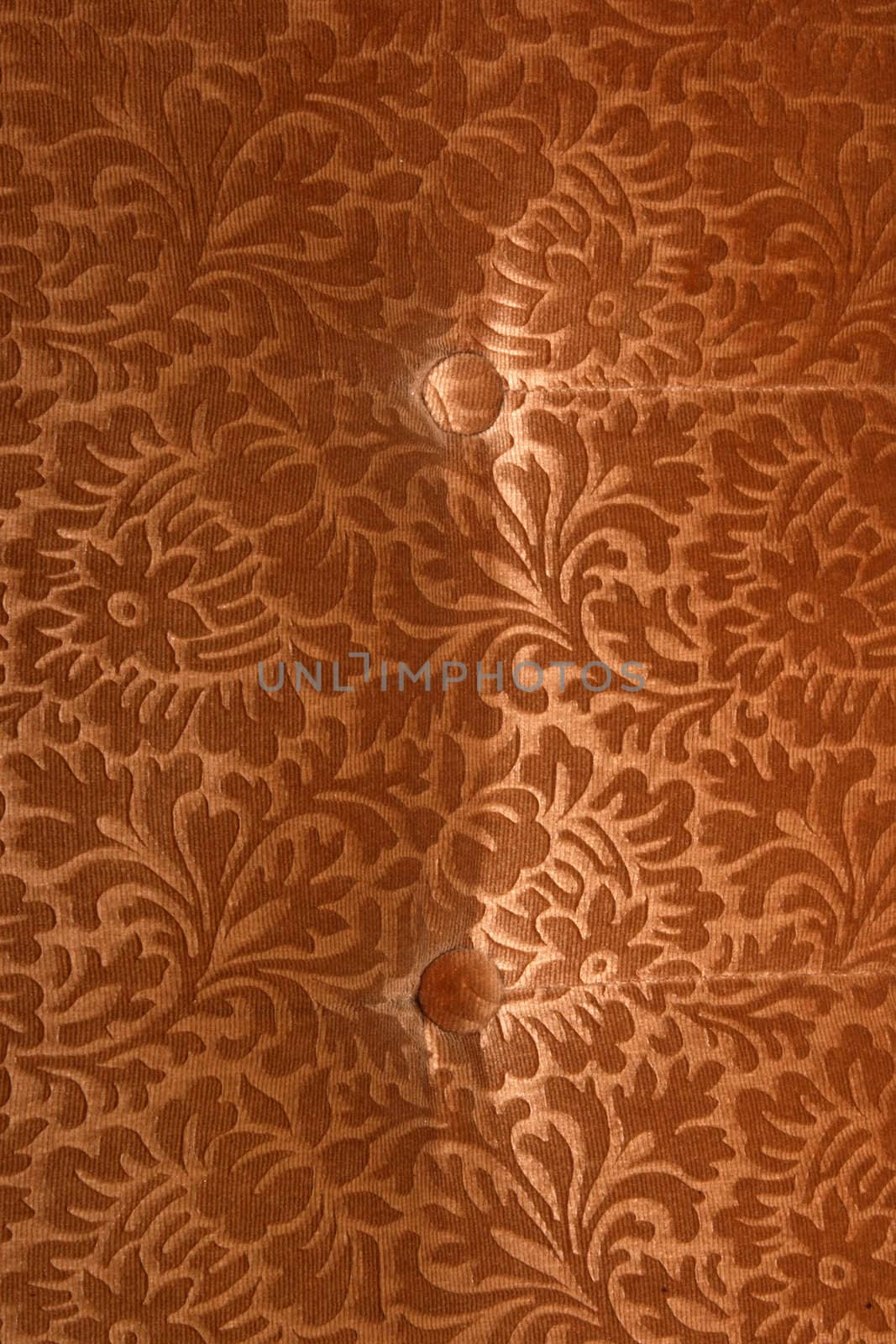 abstract retro golden velvet textile detail with butons from couch
